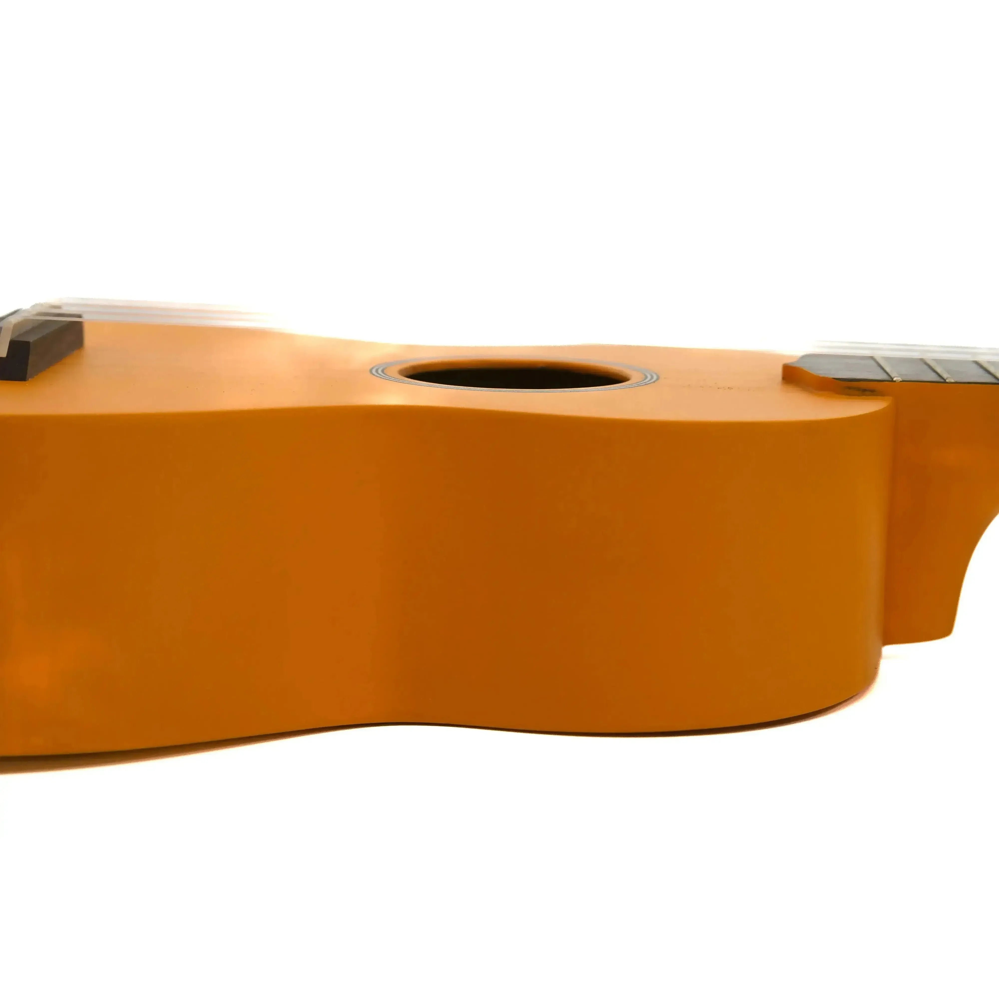 Ohana SK-10-OR orange mahogany soprano ukulele body with soundhole and bridge.