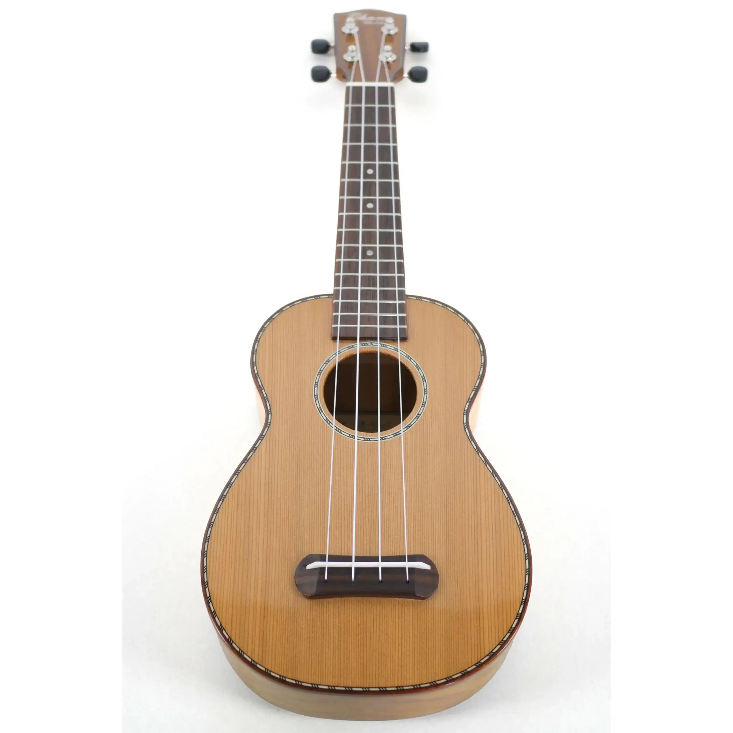 Ohana SK-50MG soprano ukulele with solid cedar top, flamed mahogany back, rope purfling, and glossy finish.