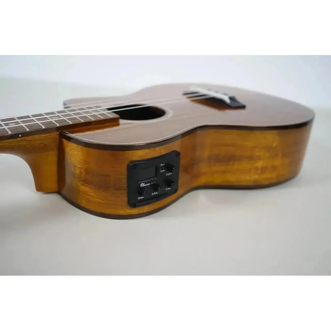 Ohana TK-270GCE tenor ukulele with solid acacia body, gloss finish, and built-in pickup controls.
