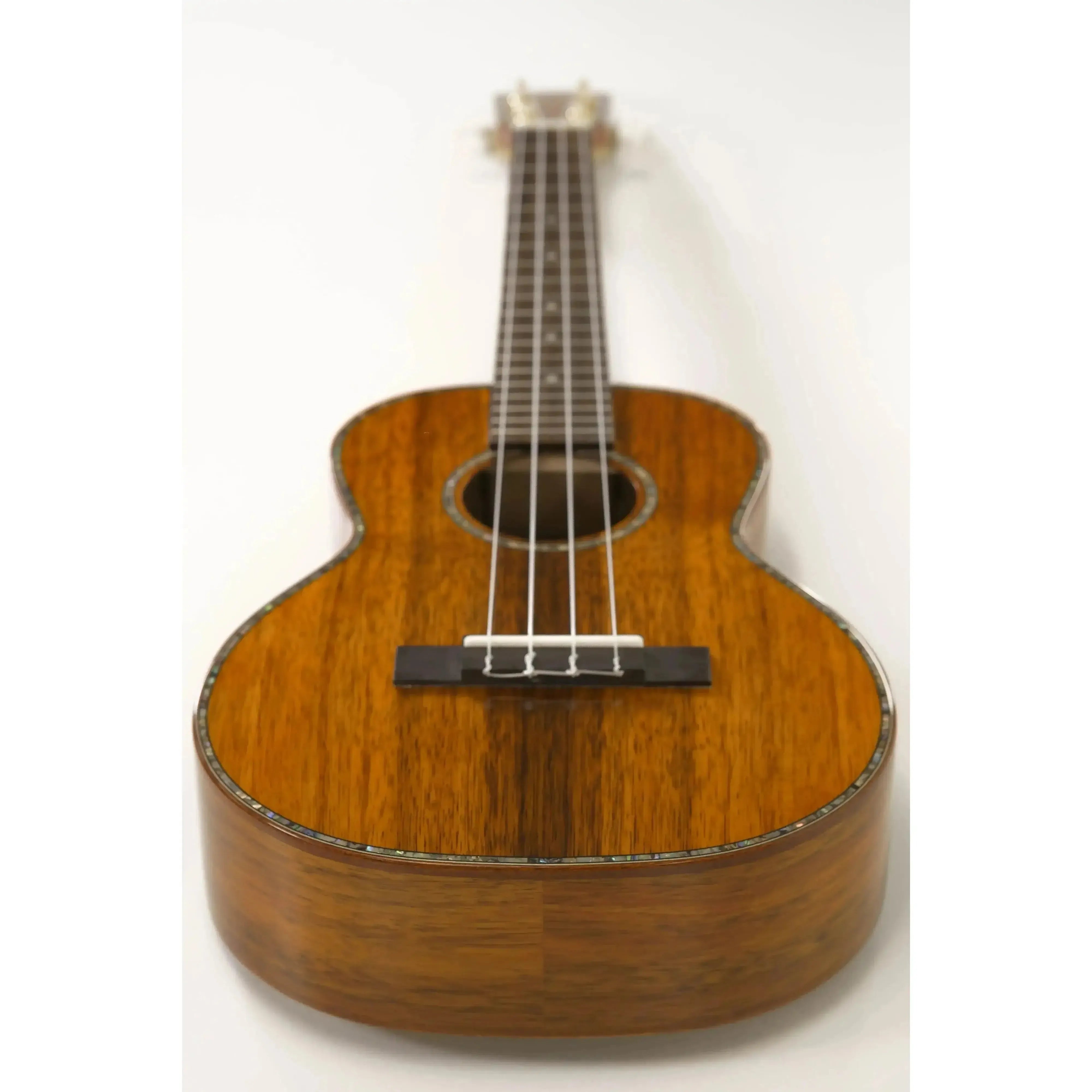 Ohana TK-350G Gloss Solid Hawaiian Koa Tenor Ukulele with mahogany binding and abalone inlay.