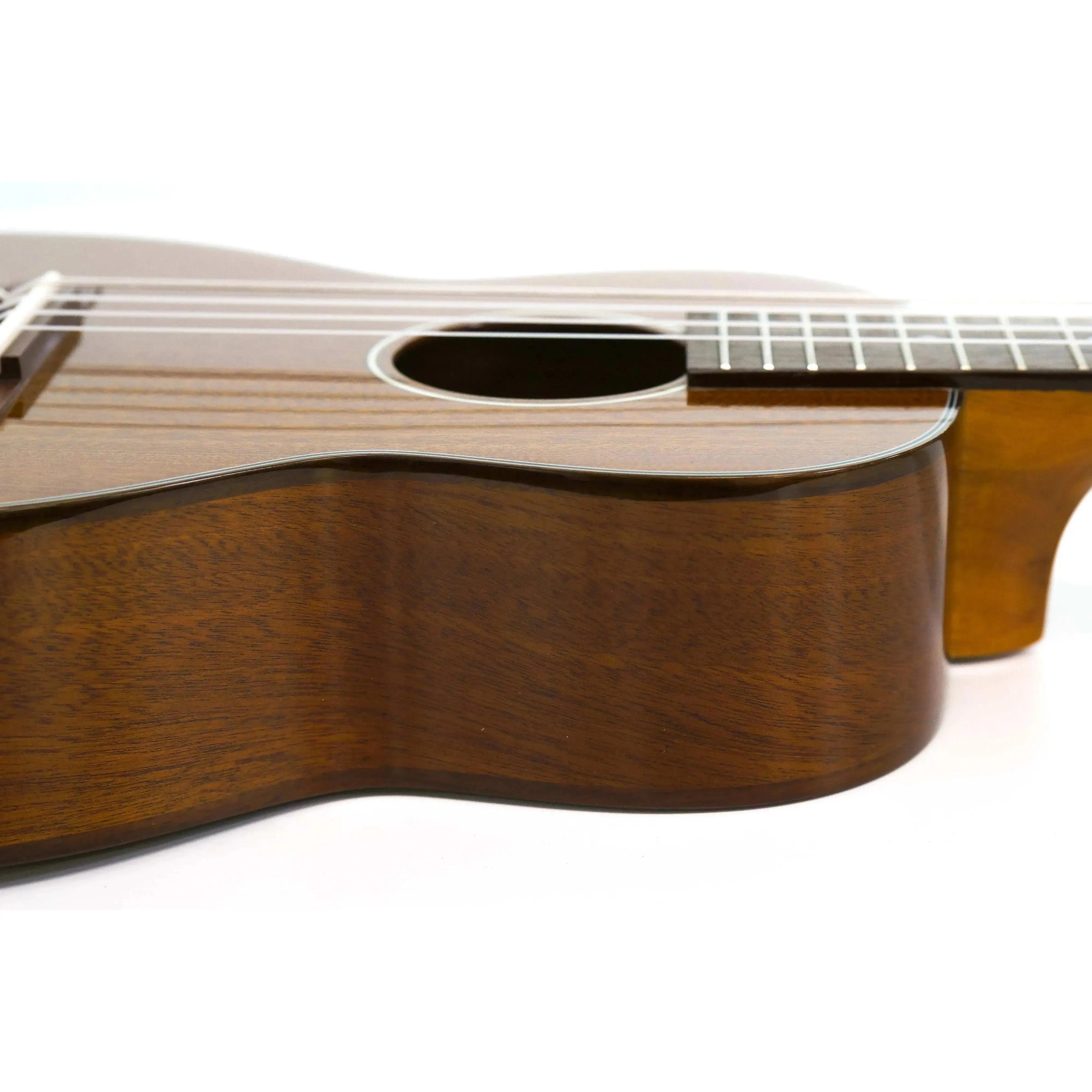 Ohana TK-35G-5 solid mahogany tenor ukulele body with glossy finish and soundhole.