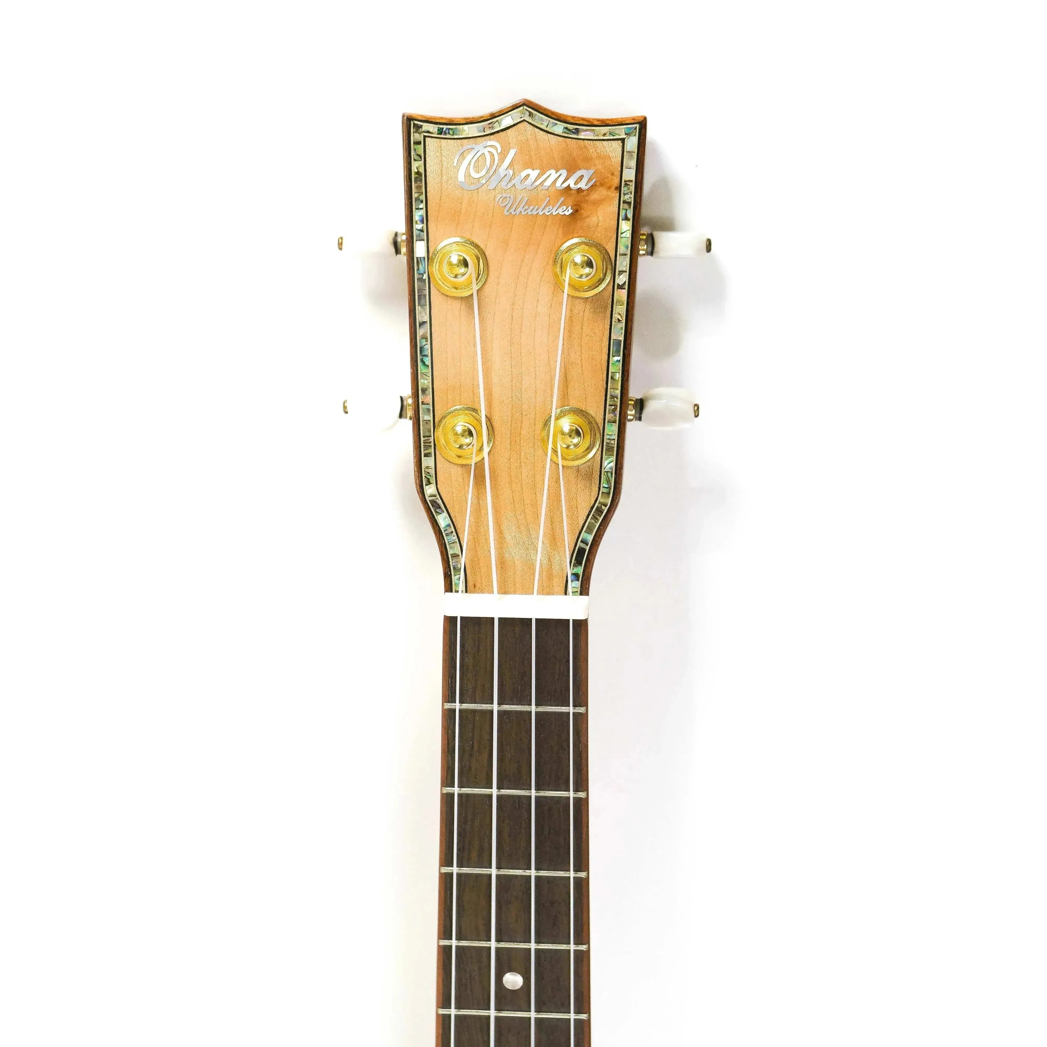 Ohana TK-75CG Tenor Ukulele headstock with abalone inlay, gold tuners, and dark fretboard.
