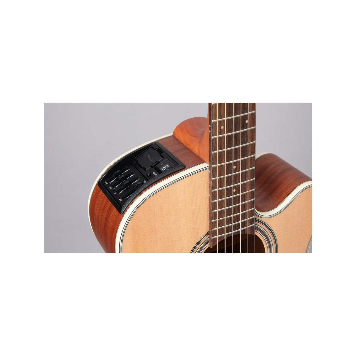 Close-up of the Takamine TP-3G preamp mounted on the upper bout of the GX31CE, beside the fingerboard.