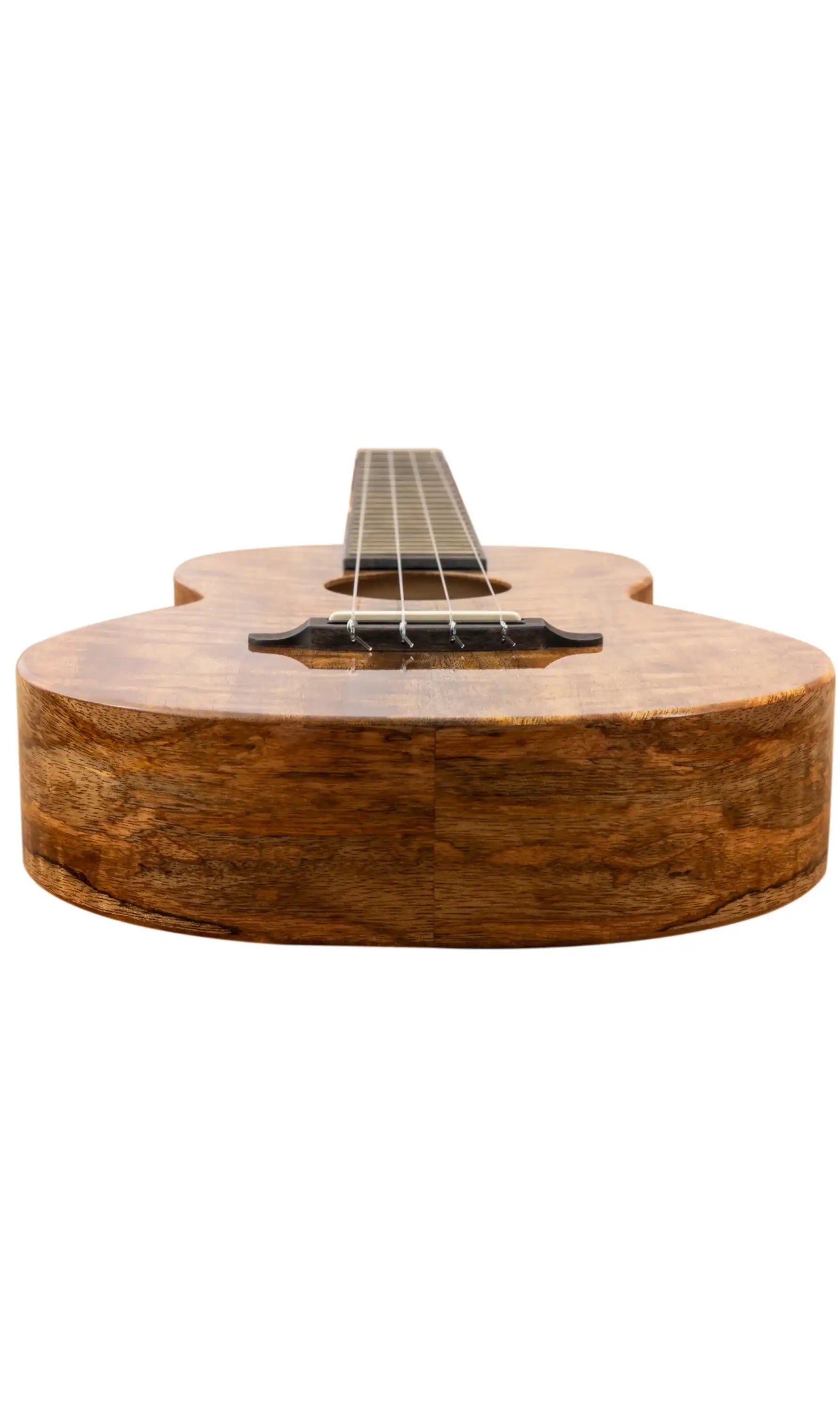 Front view of a koa wood ukulele with four strings at Terry Carter Music Store