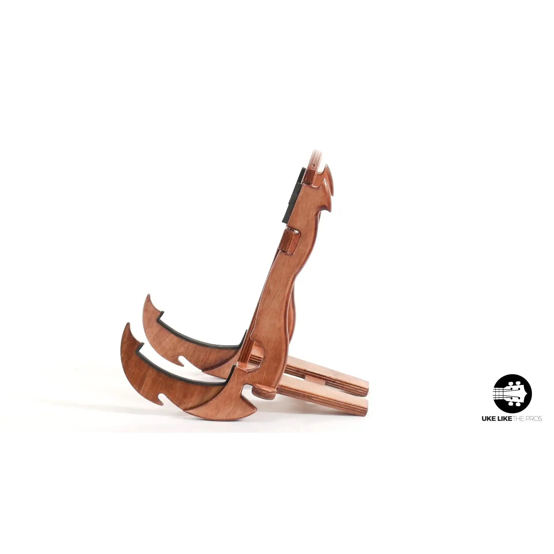 Wooden ukulele stand shaped like a Maui hook, tenor size, at Terry Carter Music Store.