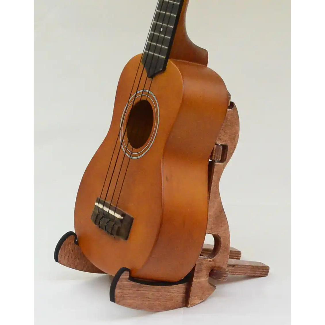 Matte finish ukulele with brown wood stand, Terry Carter Music Store product photo.
