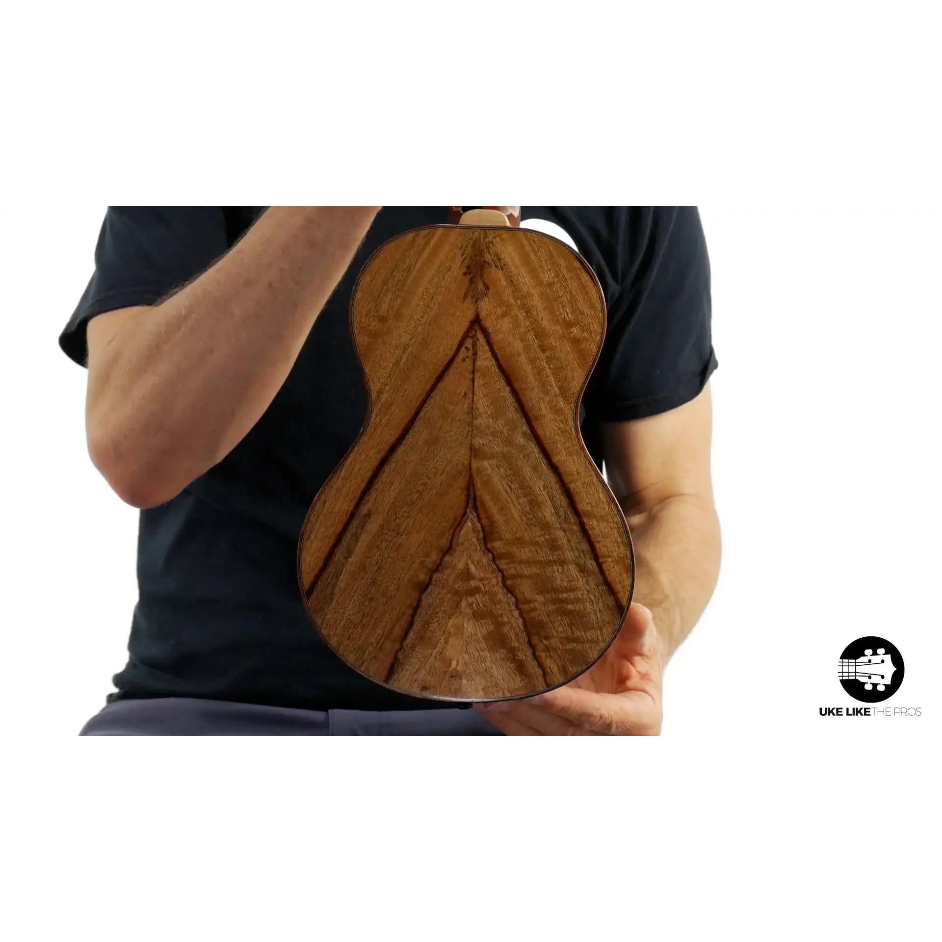 Back of Mya-Moe ukulele in chocolate heart wood, showcased at Terry Carter Music Store.