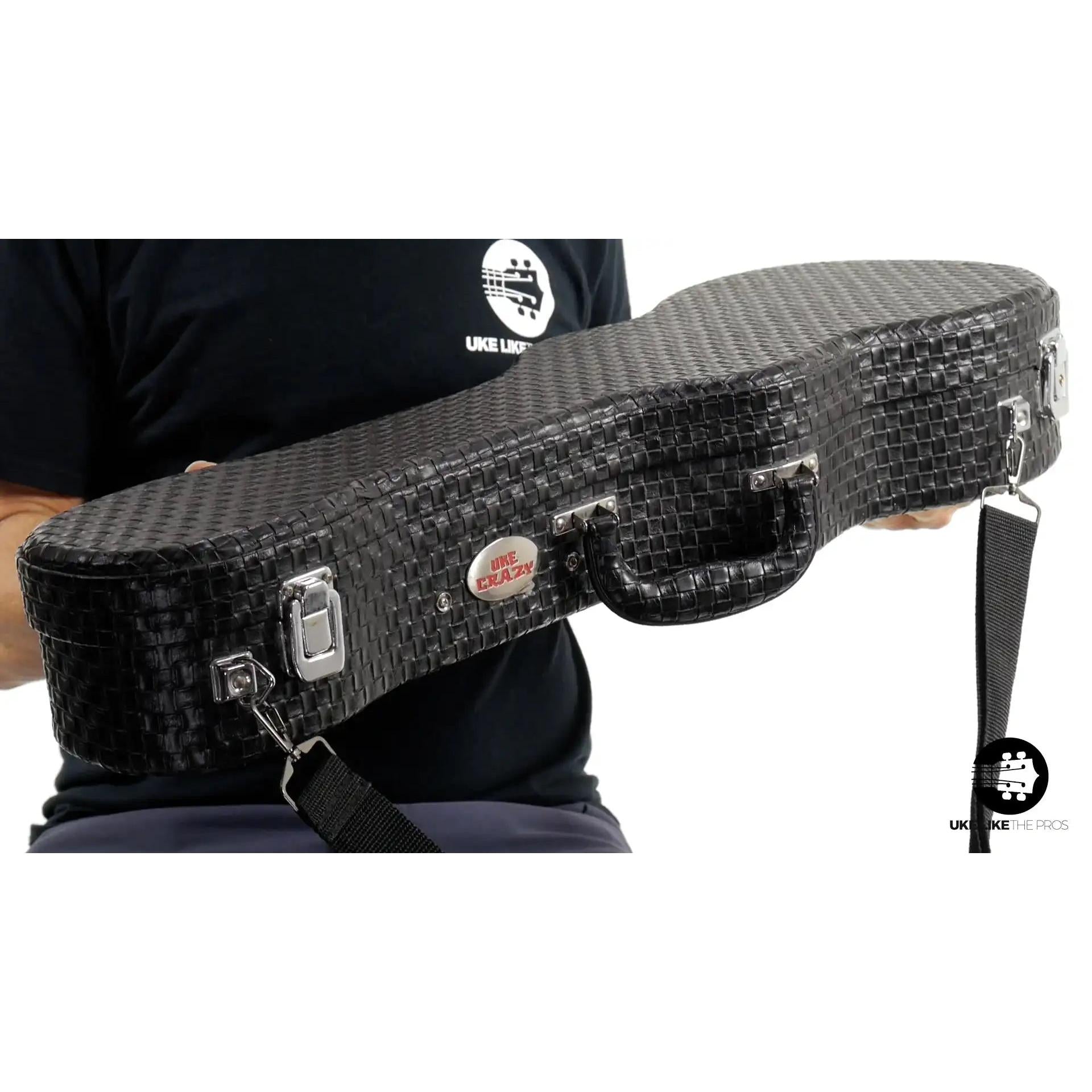 Black textured UkeCrazy ukulele case with metal latches, shown at Terry Carter Music Store