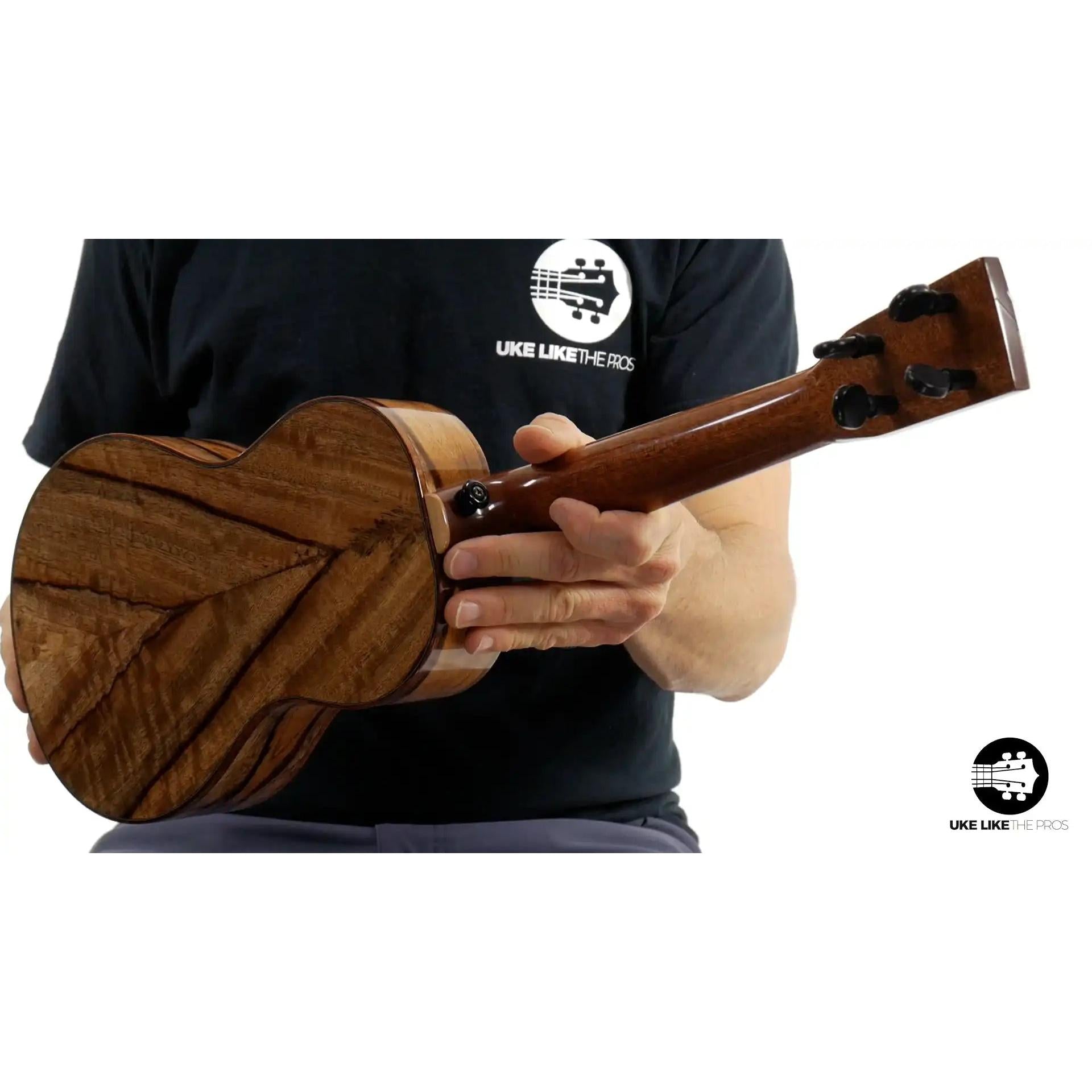 Mya-Moe ukulele with figured chocolate heart wood back, showcased at Terry Carter Music Store.