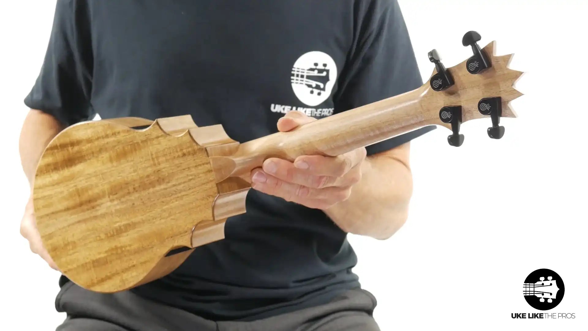 Back of solid wood ukulele with unique headstock, natural finish at Terry Carter Music Store
