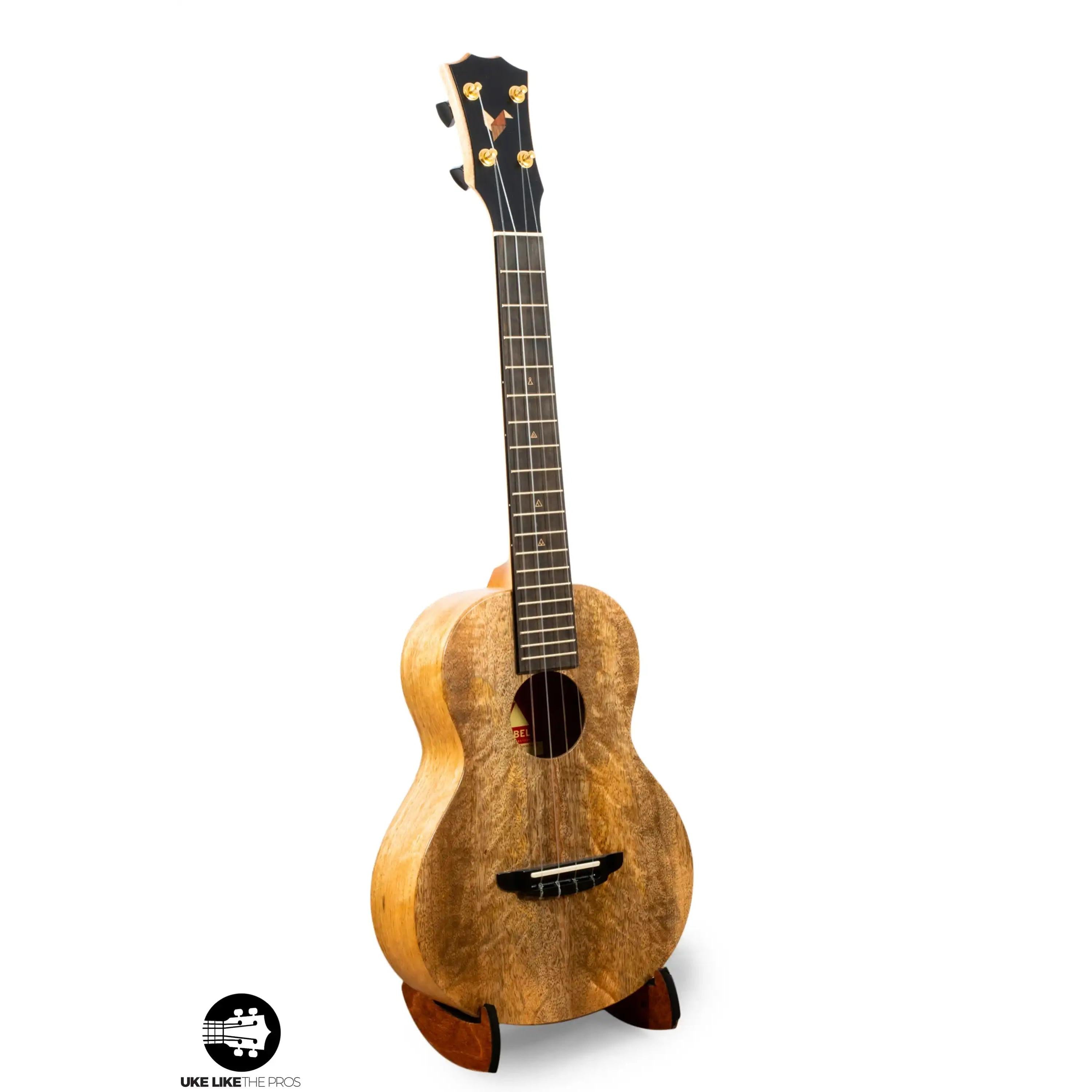 Romero Creations Bearclaw uke with natural wood finish on stand at Terry Carter Music Store