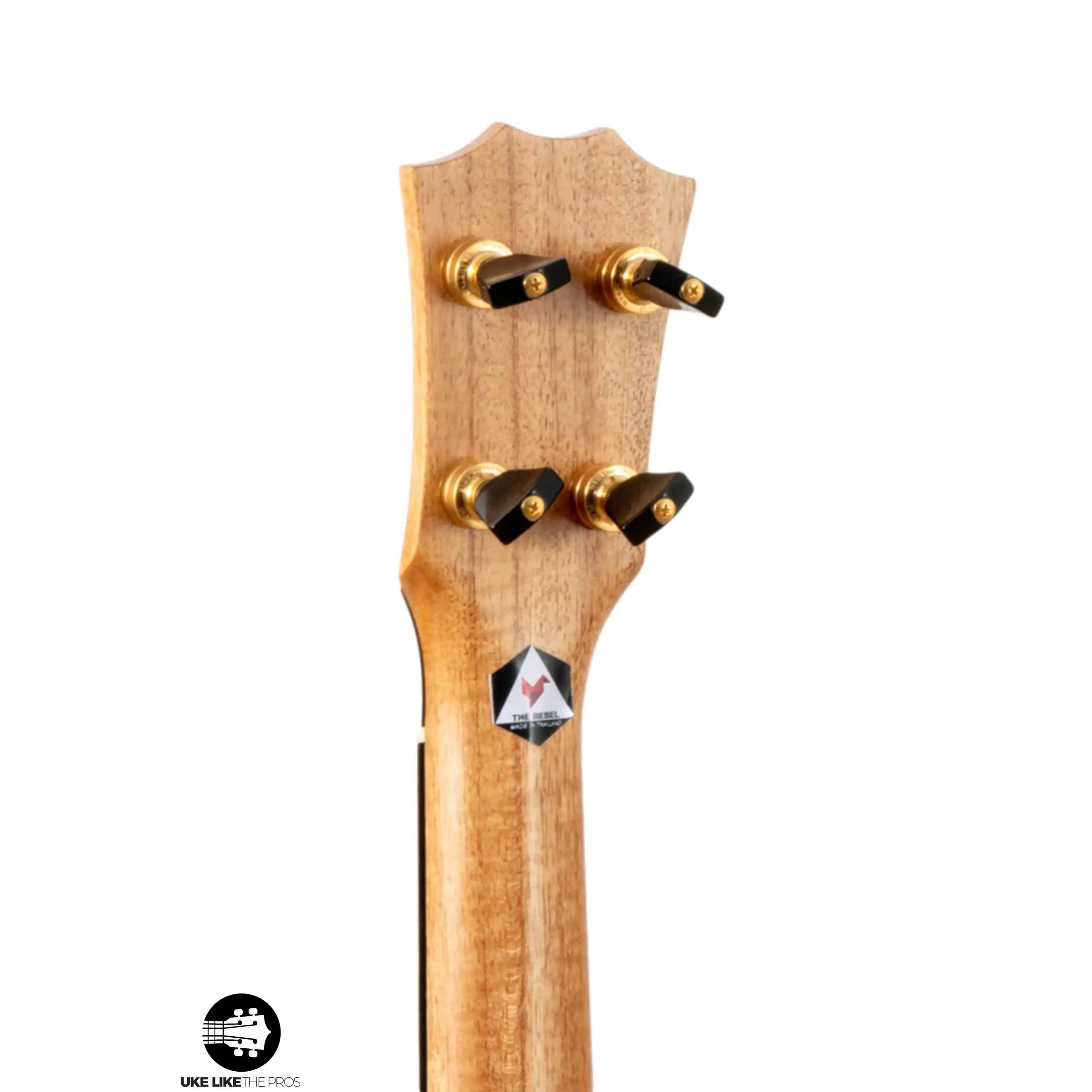 The Rebel ukulele headstock with gold tuners, natural wood finish at Terry Carter Music Store.