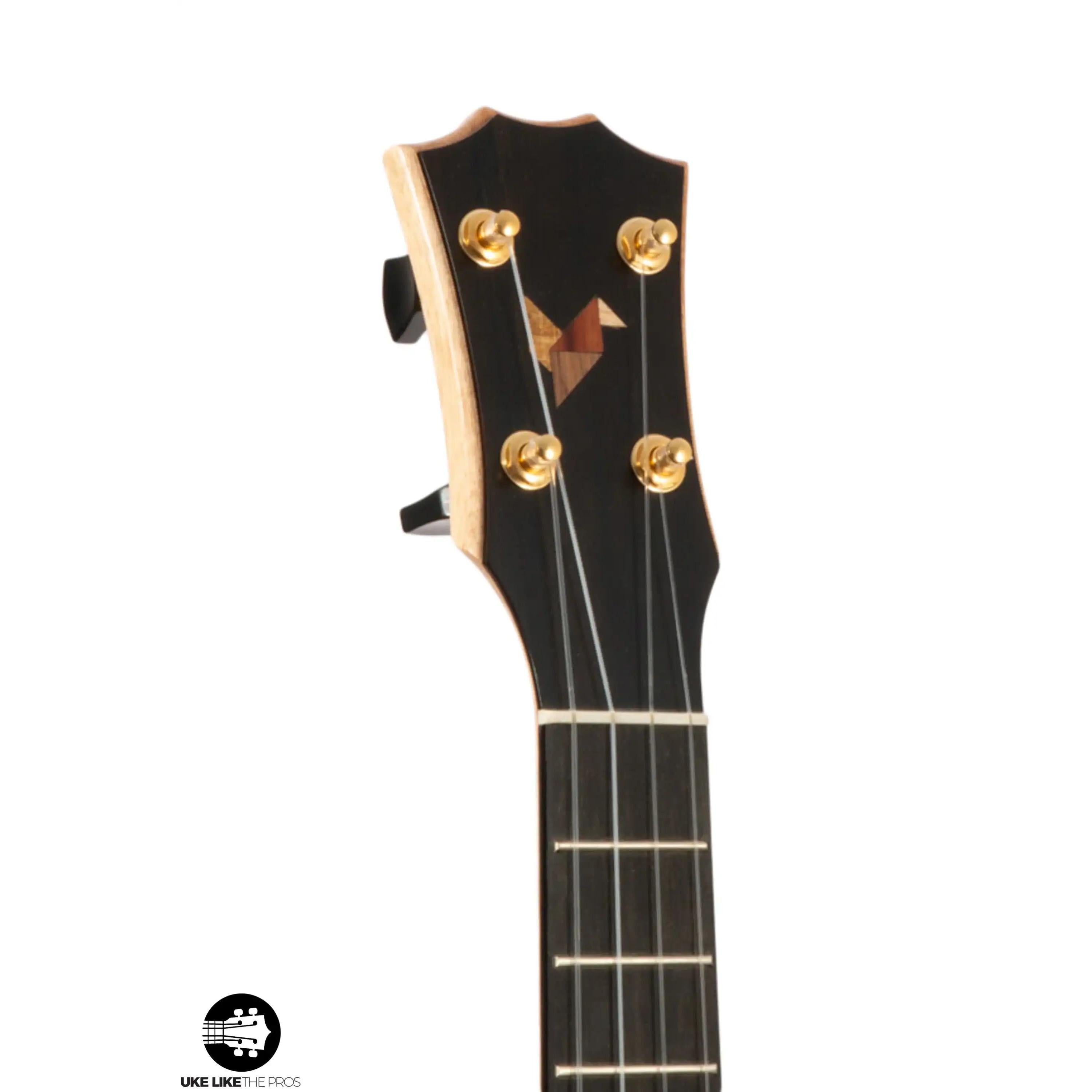 Romero Creations uke headstock with gold tuners and wood inlay, Terry Carter Music Store