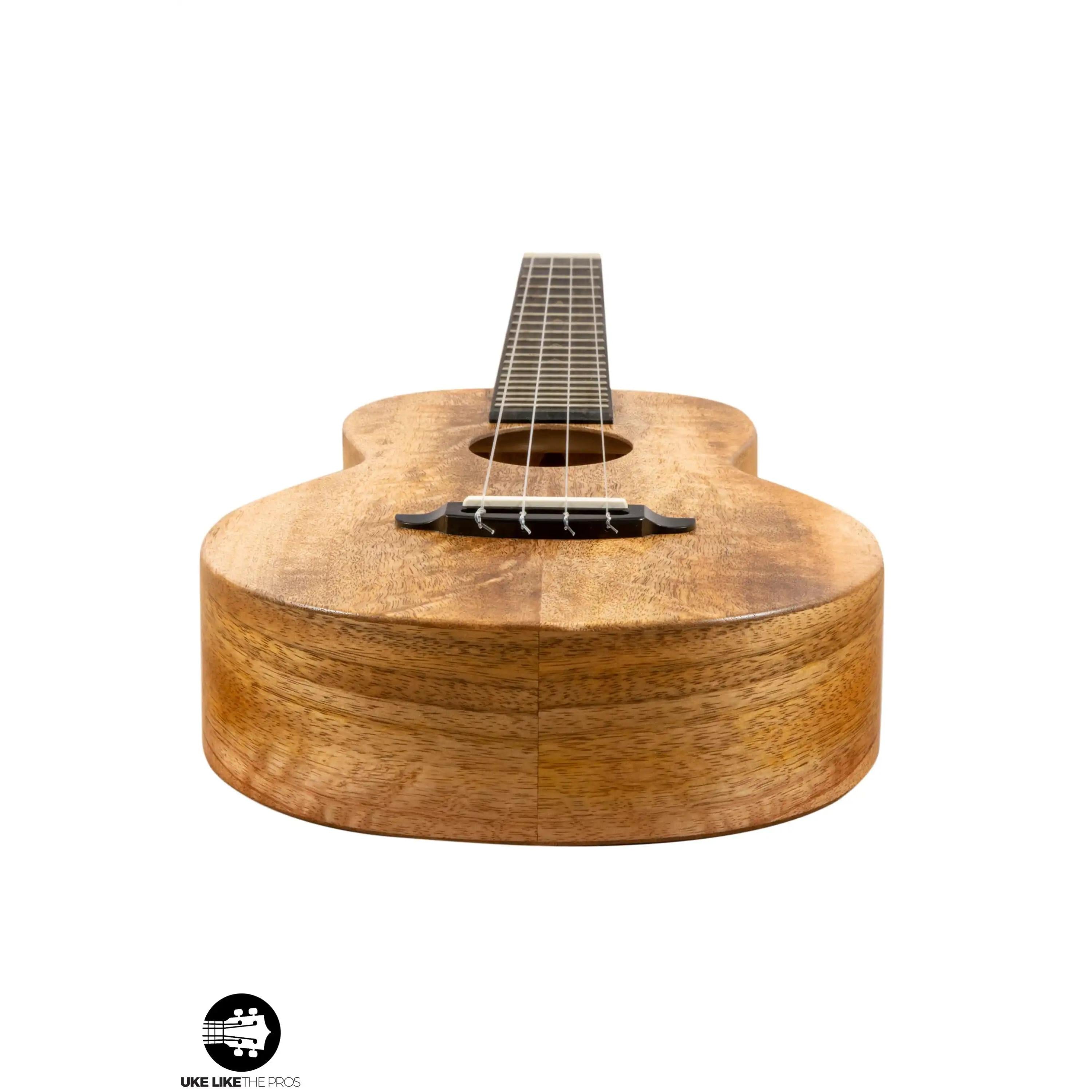 Romero Creations koa wood ukulele body close-up, showcased at Terry Carter Music Store