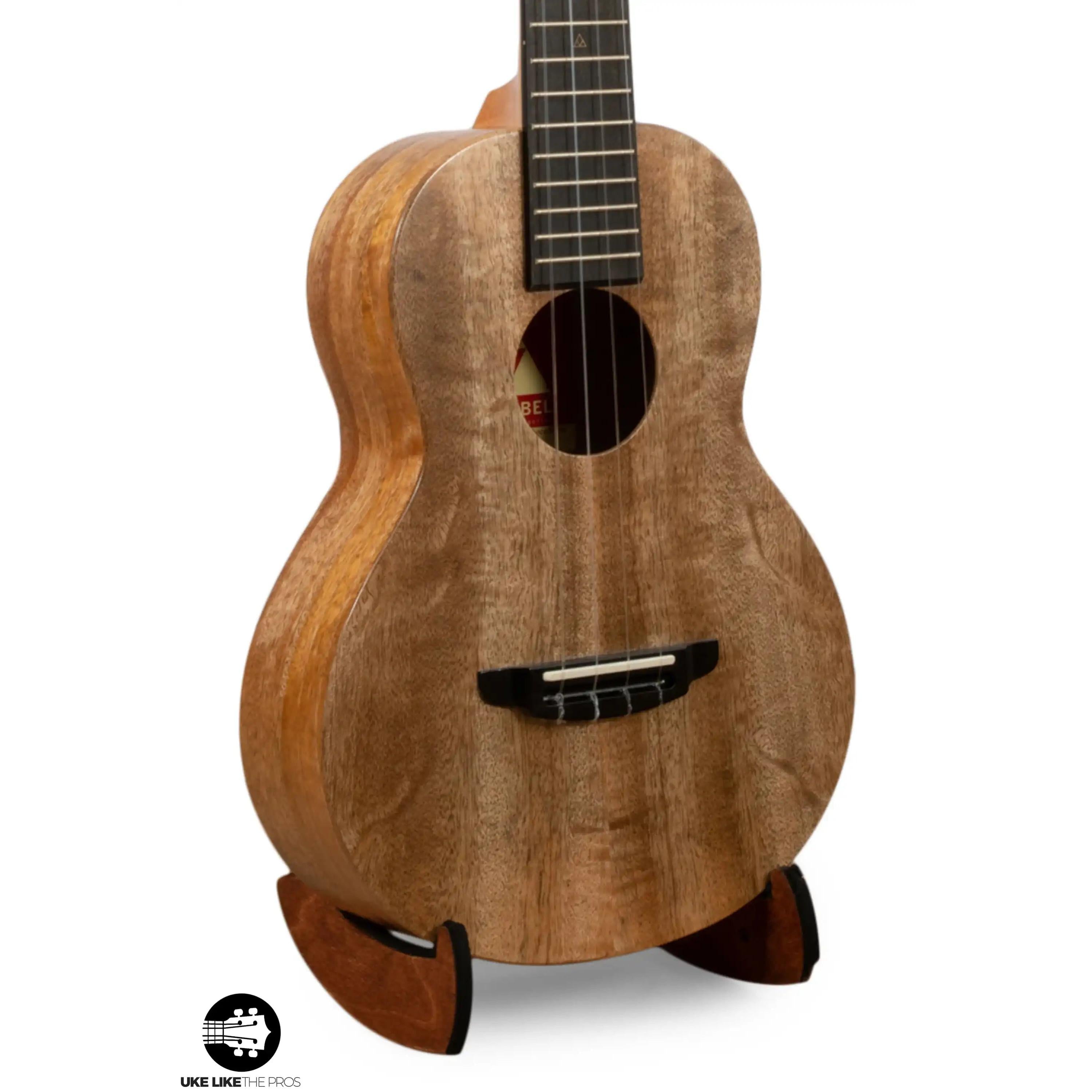 Romero Creations ukulele with natural wood finish on stand, Terry Carter Music Store