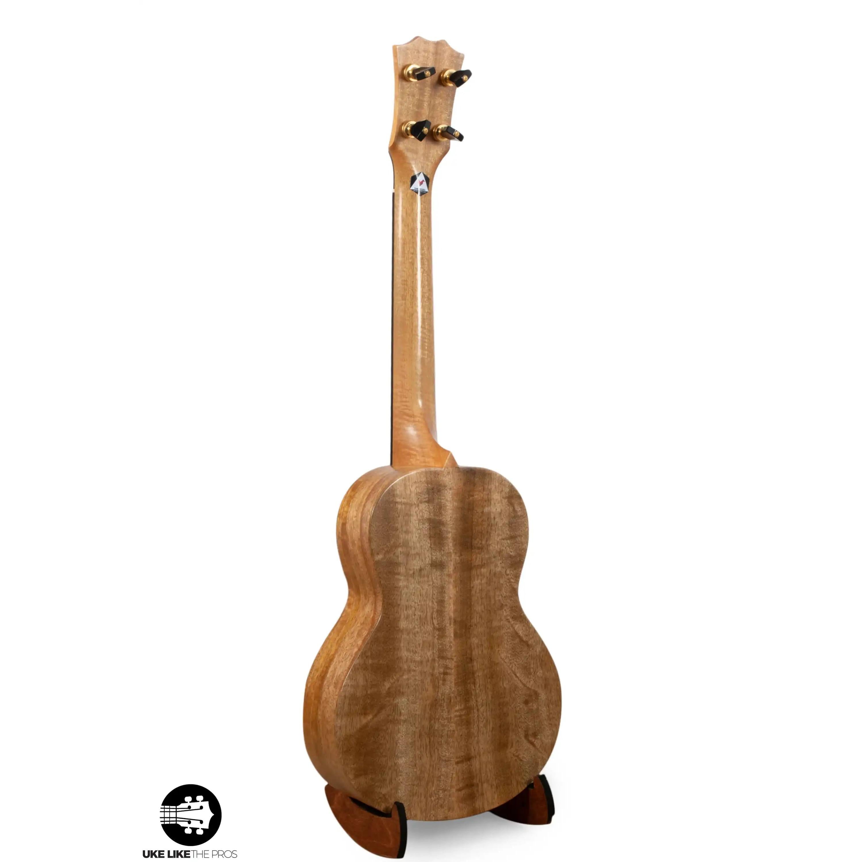 Romero Creations tenor ukulele with figured wood back, on stand at Terry Carter Music Store