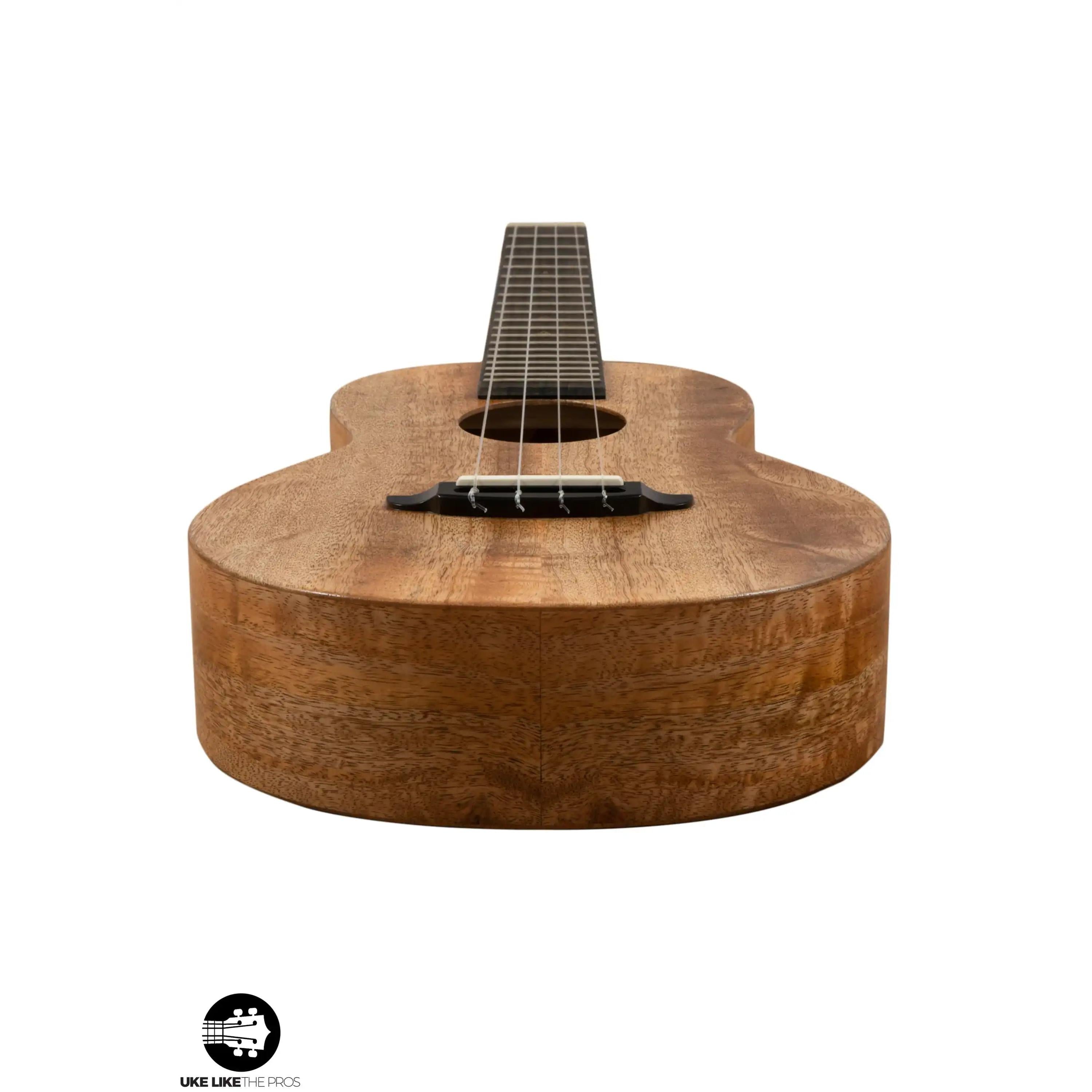 Romero Creations ukulele with natural wood finish, front angle, Terry Carter Music Store