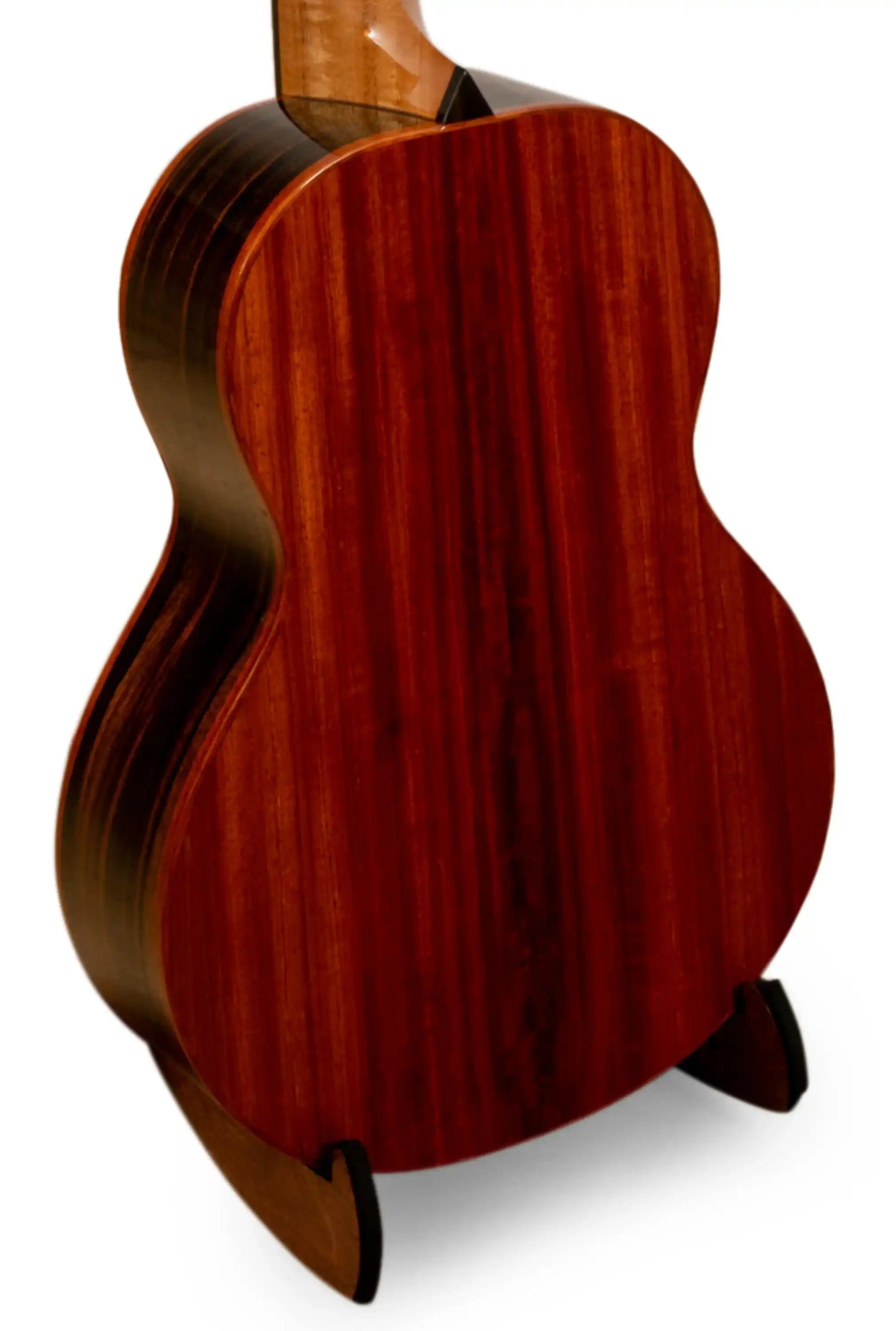 Back of an acoustic guitar with rich mahogany wood grain at Terry Carter Music Store