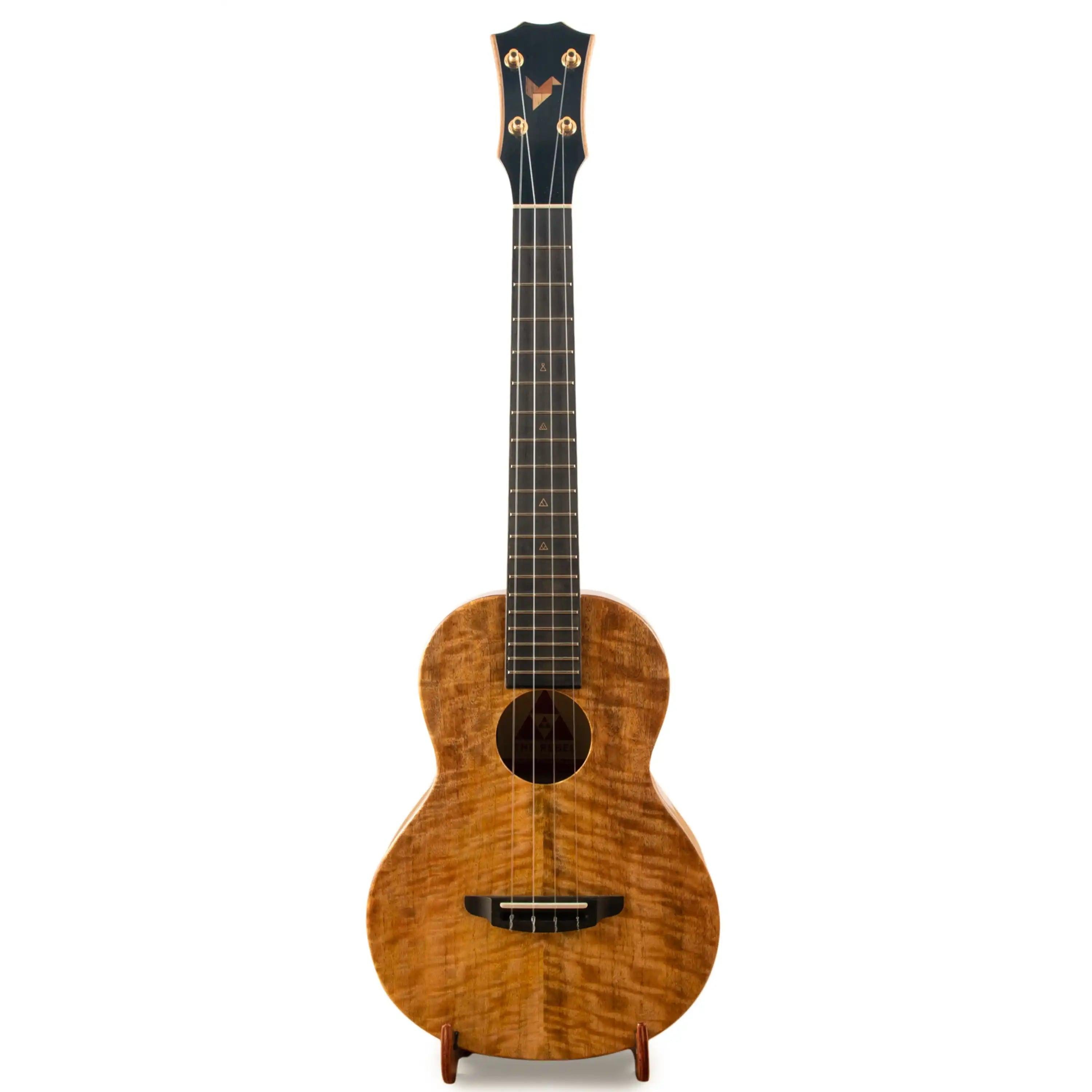 Rebel ukulele with natural wood grain finish, front view, at Terry Carter Music Store