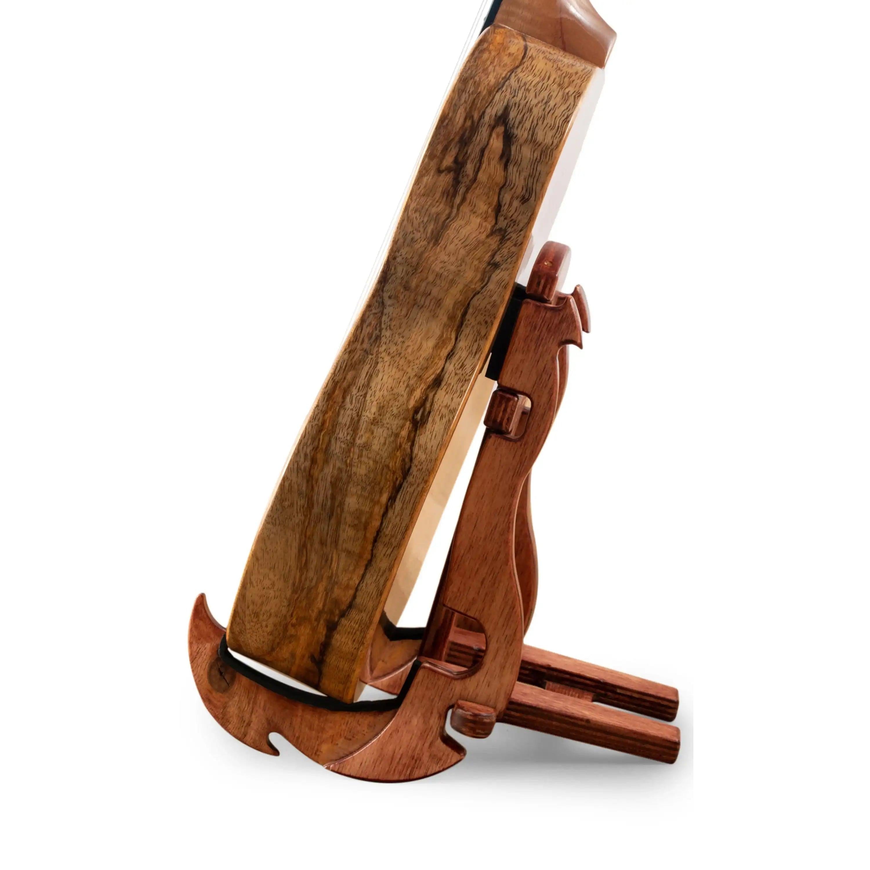 Side view of wooden instrument body with natural grain on a wood stand at Terry Carter Music Store