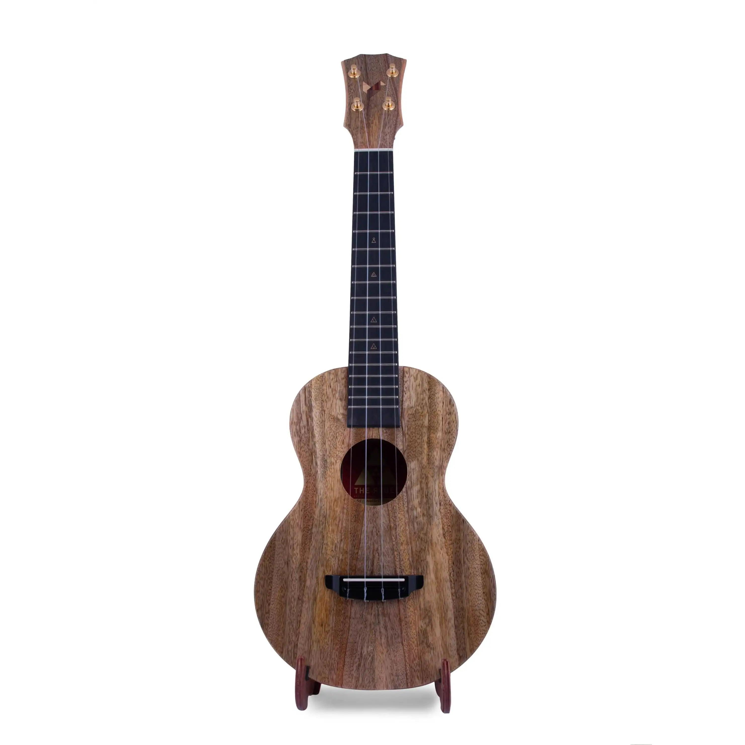 Rebel ukulele with natural wood grain finish on stand, product photo for Terry Carter Music Store