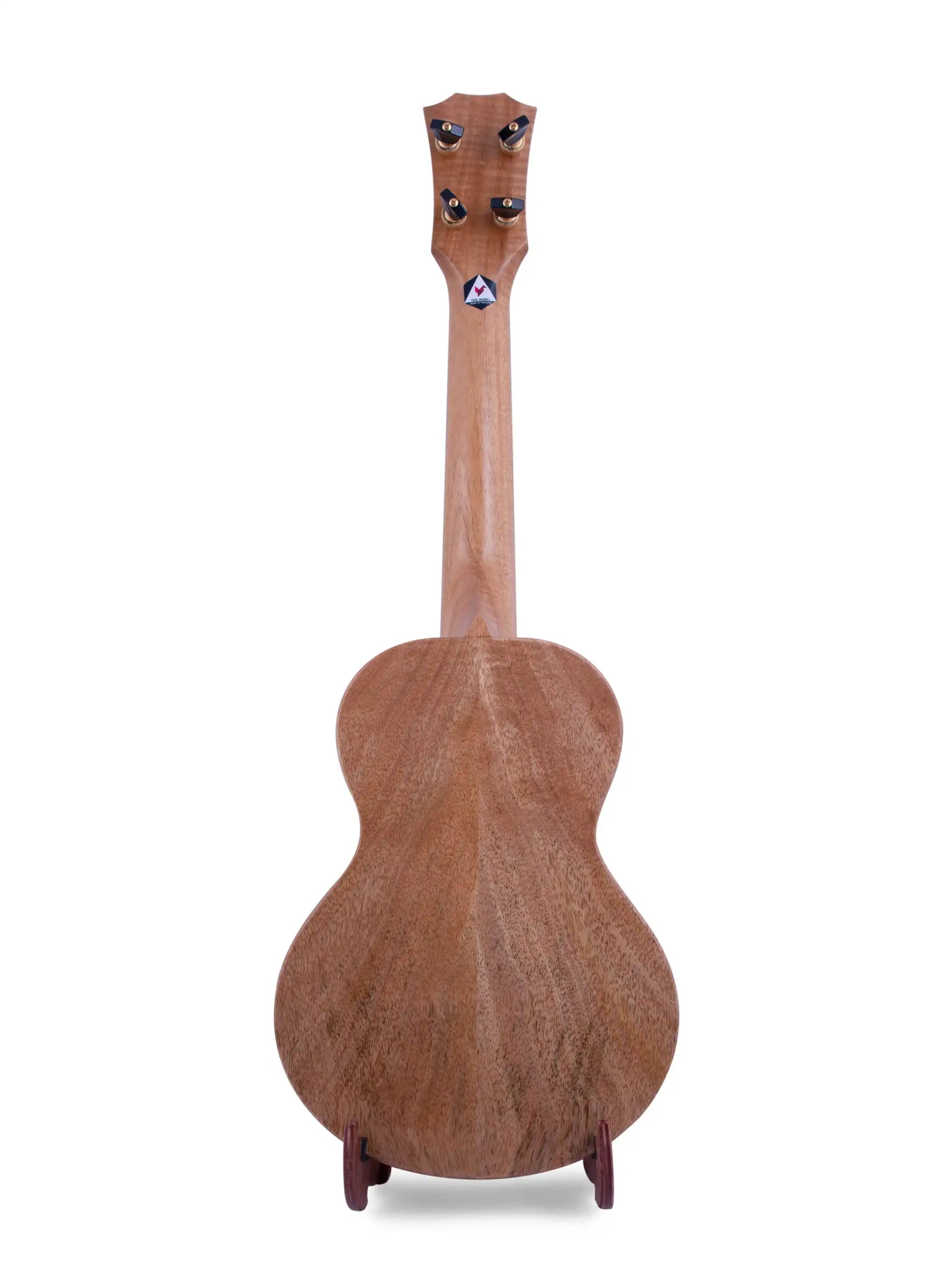 Back view of Rebel ukulele with natural wood grain, displayed at Terry Carter Music Store.