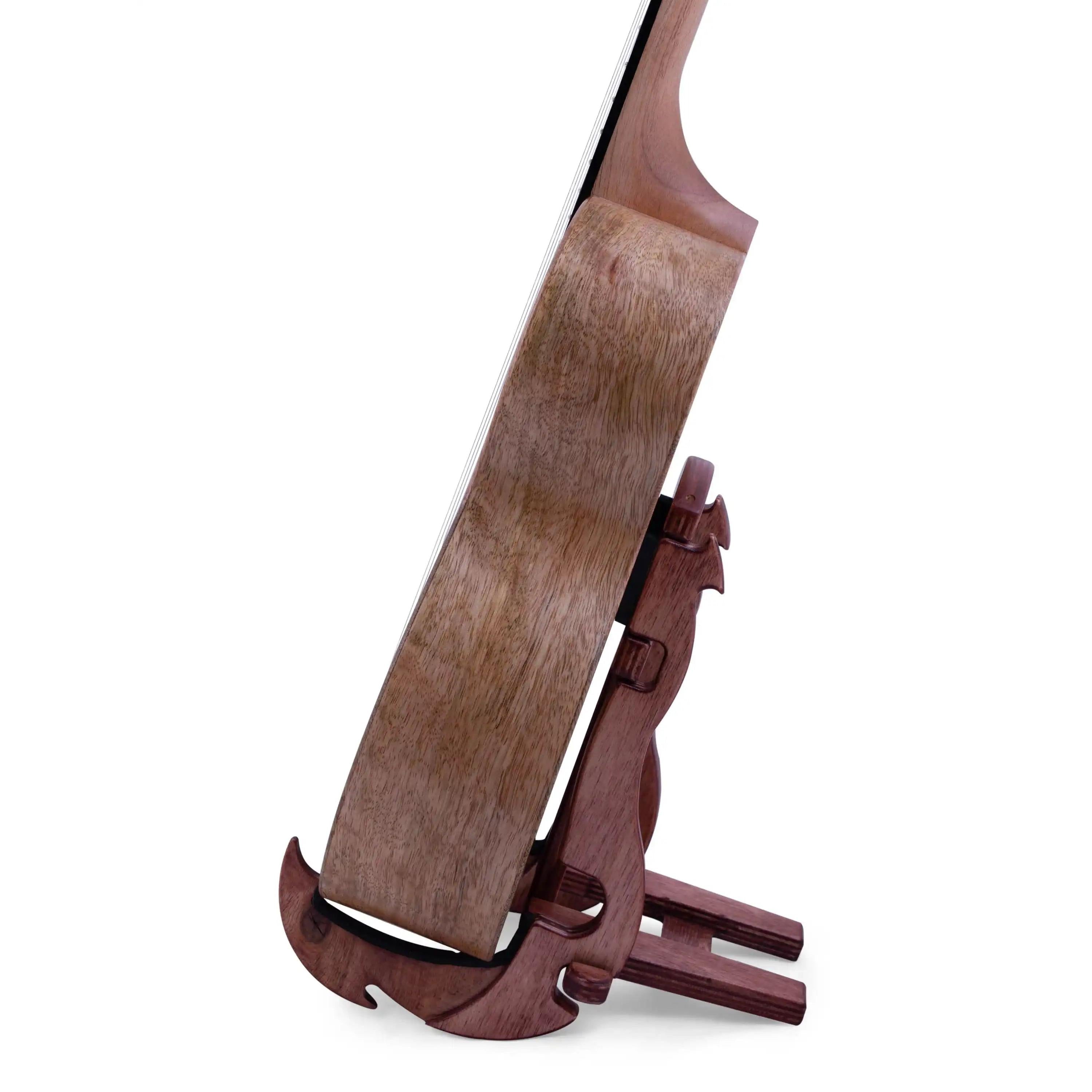 Side view of a natural wood ukulele on a seahorse-shaped wooden stand at Terry Carter Music Store.