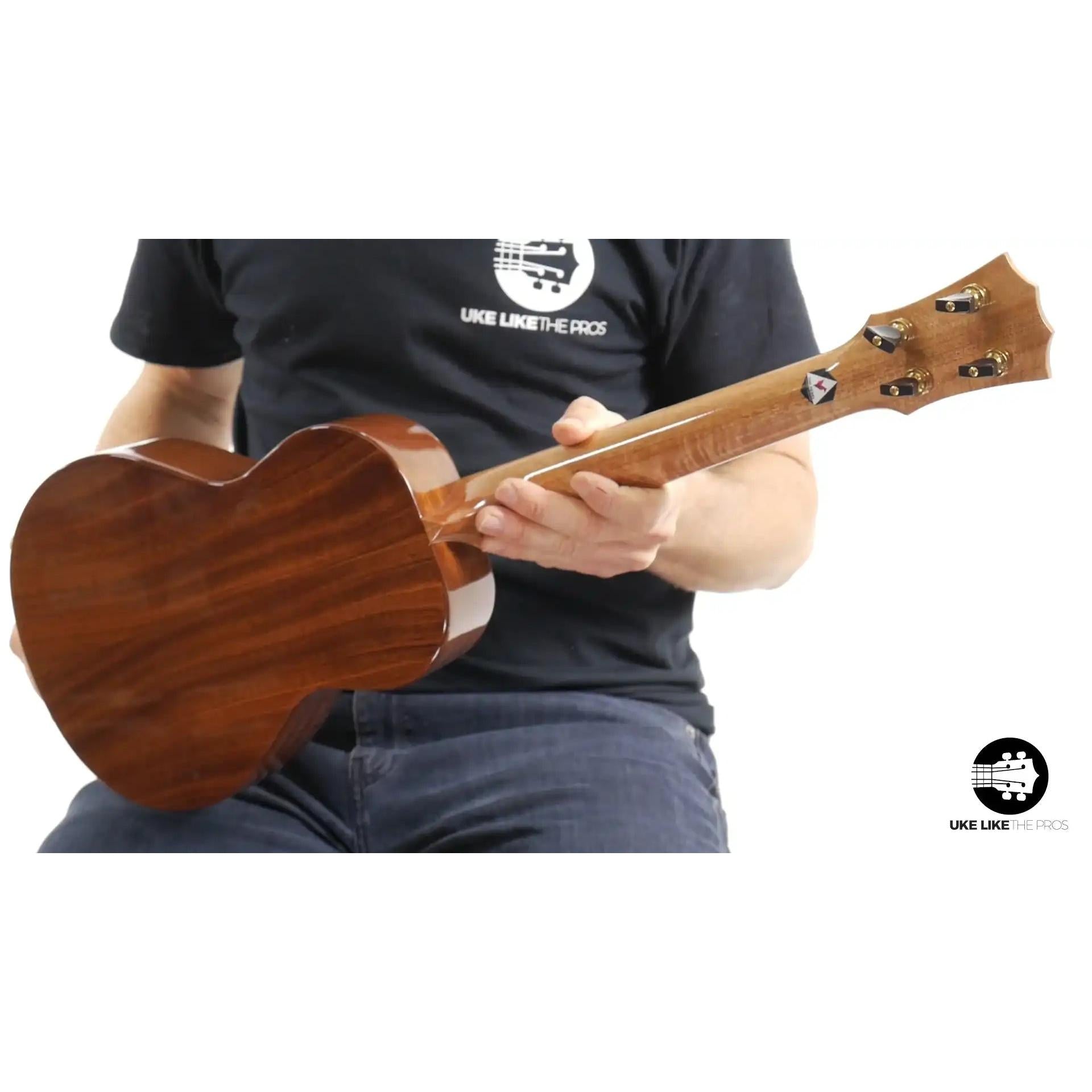 Rebel Double Cheese ukulele back view with rich wood grain, shown at Terry Carter Music Store.