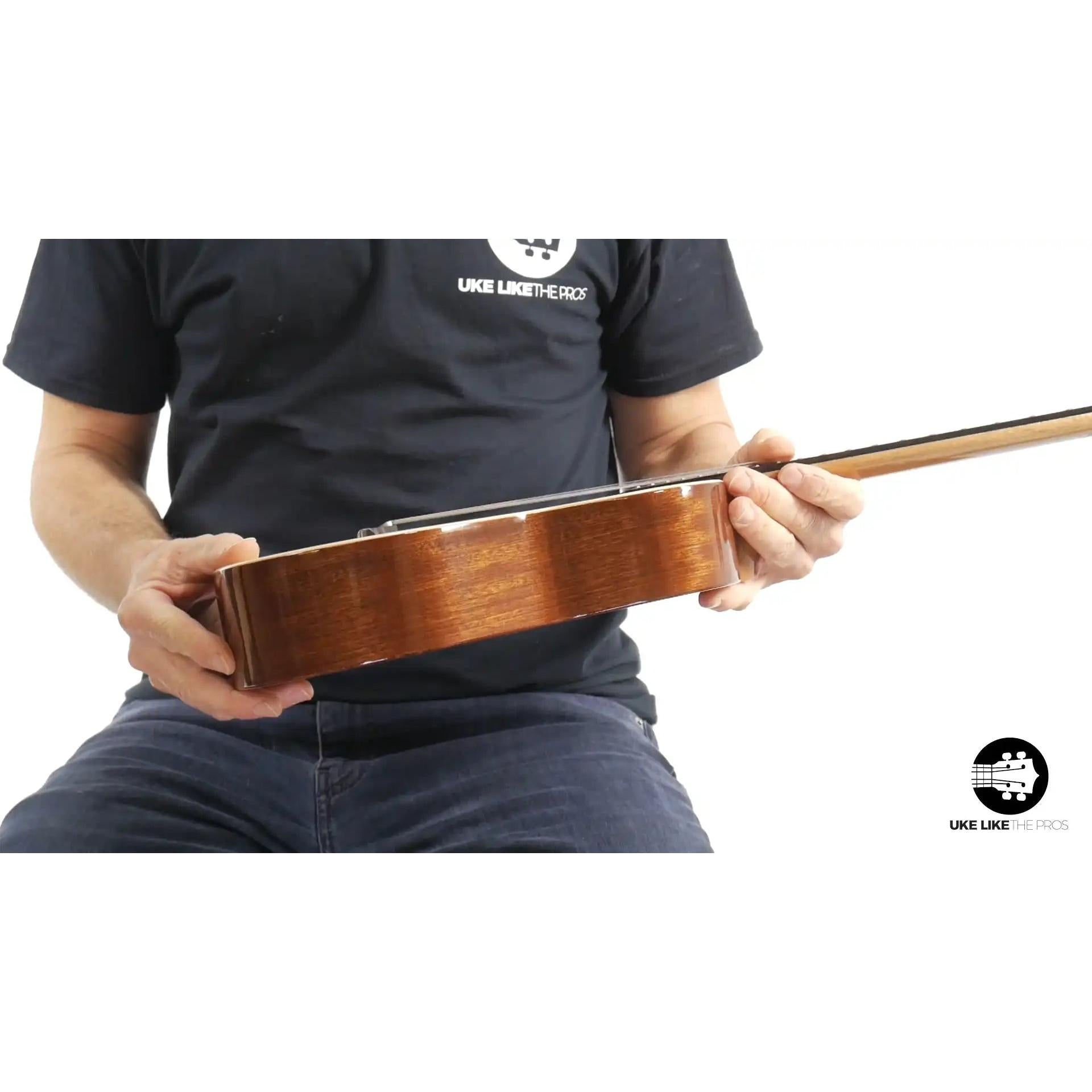 Rebel Double Cheese Spitfire ukulele side view, natural wood finish at Terry Carter Music Store