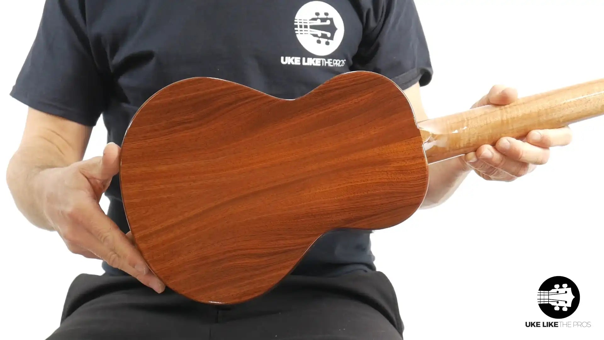 Rebel tenor ukulele back view with rich wood grain, featured at Terry Carter Music Store.