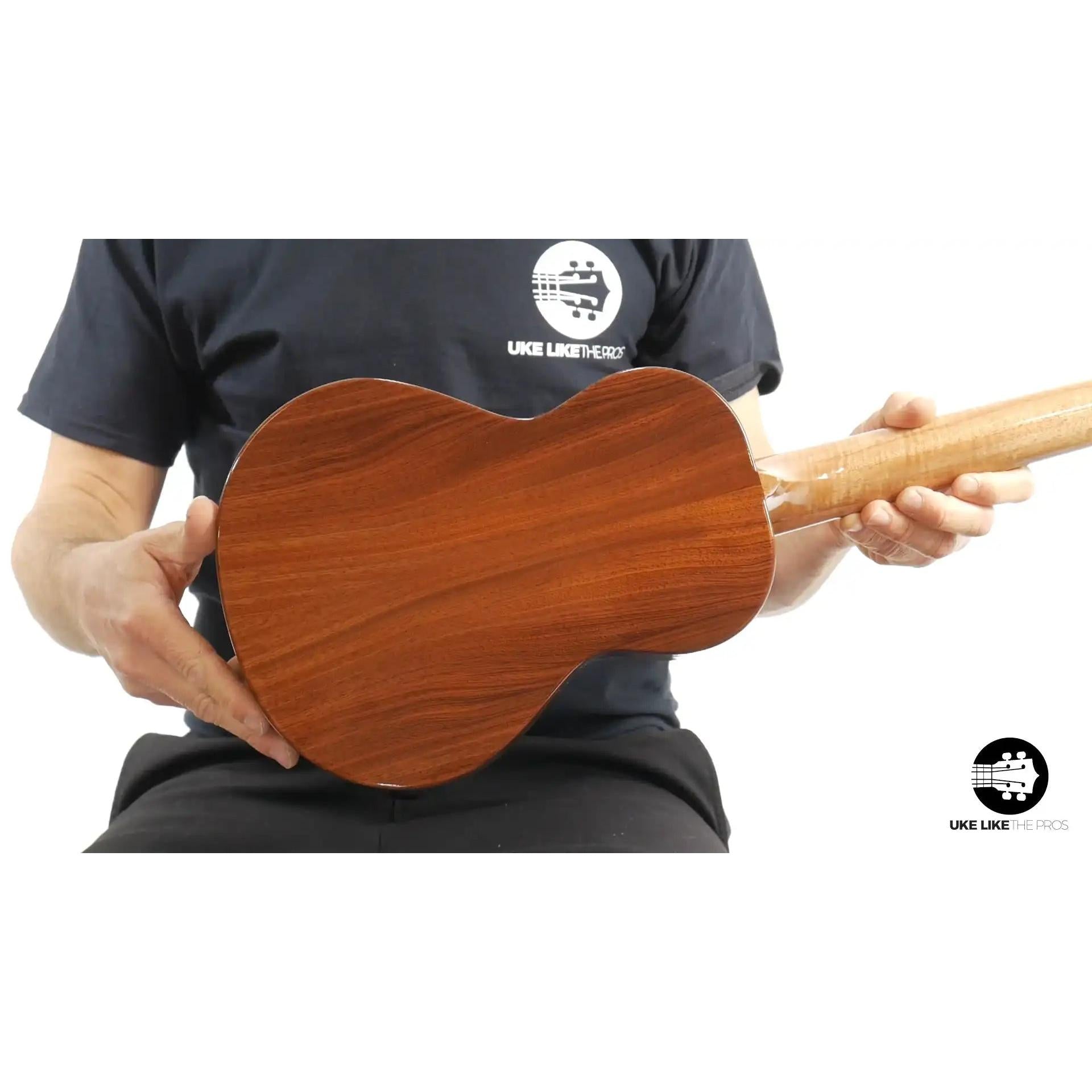 Rebel tenor ukulele back view with rich wood grain, featured at Terry Carter Music Store.