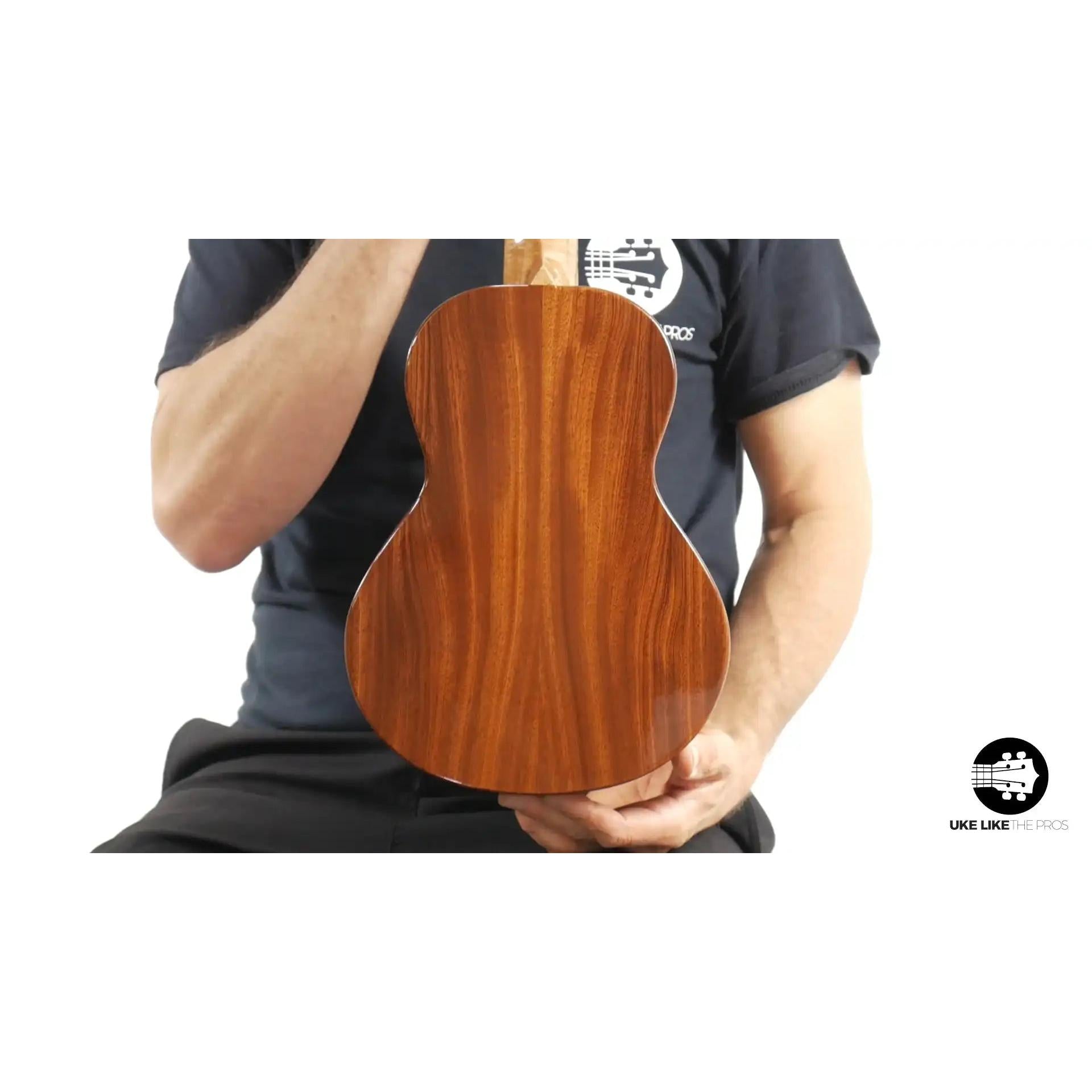Rebel tenor ukulele with glossy wood back, showcased at Terry Carter Music Store.