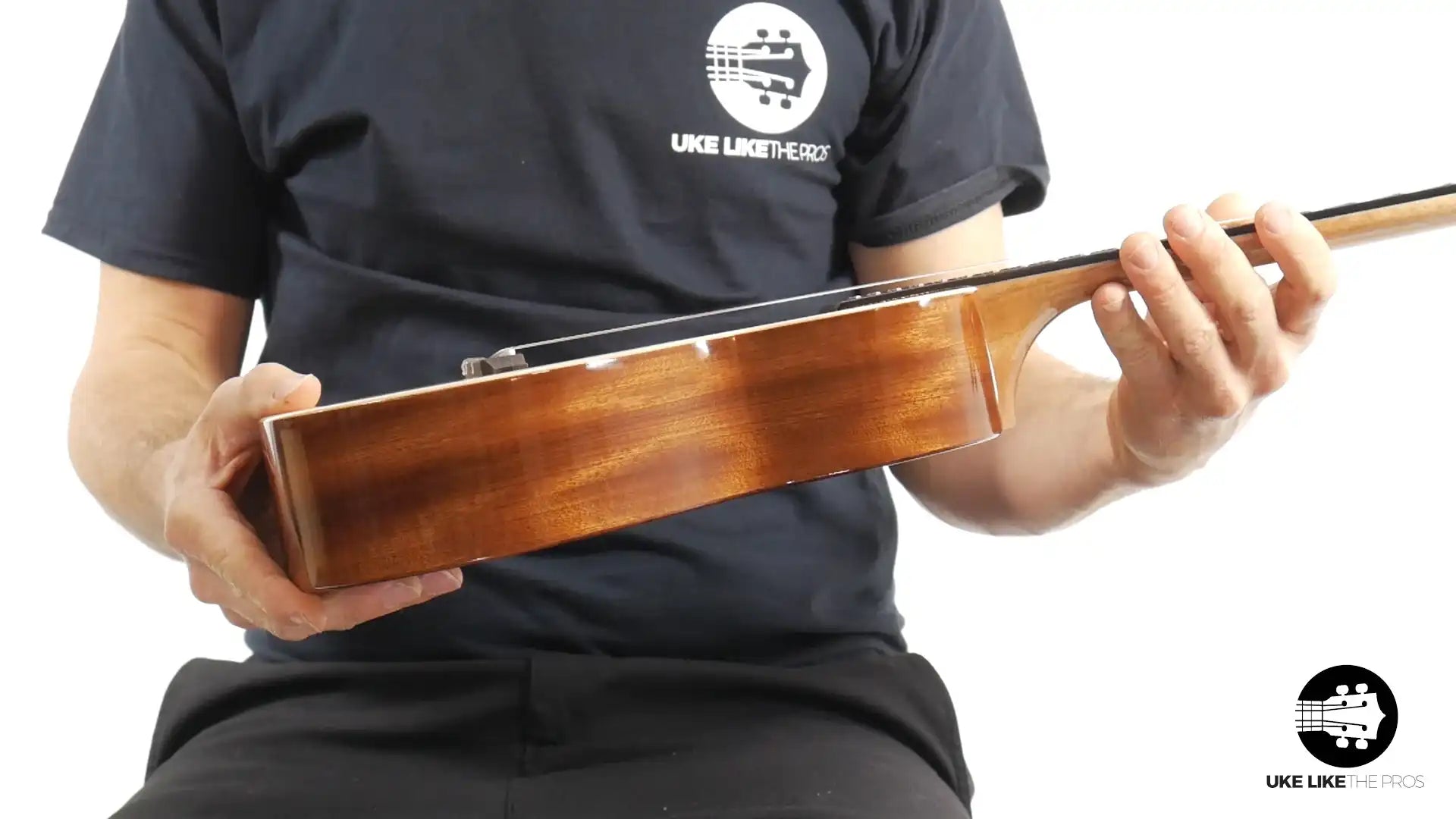 Side view of Rebel Double Cheese tenor ukulele with glossy wood finish at Terry Carter Music Store