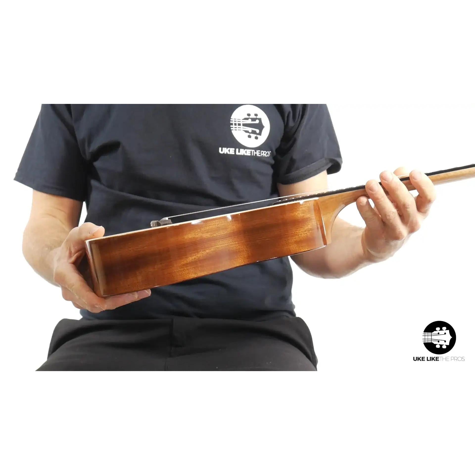 Side view of Rebel Double Cheese tenor ukulele with glossy wood finish at Terry Carter Music Store