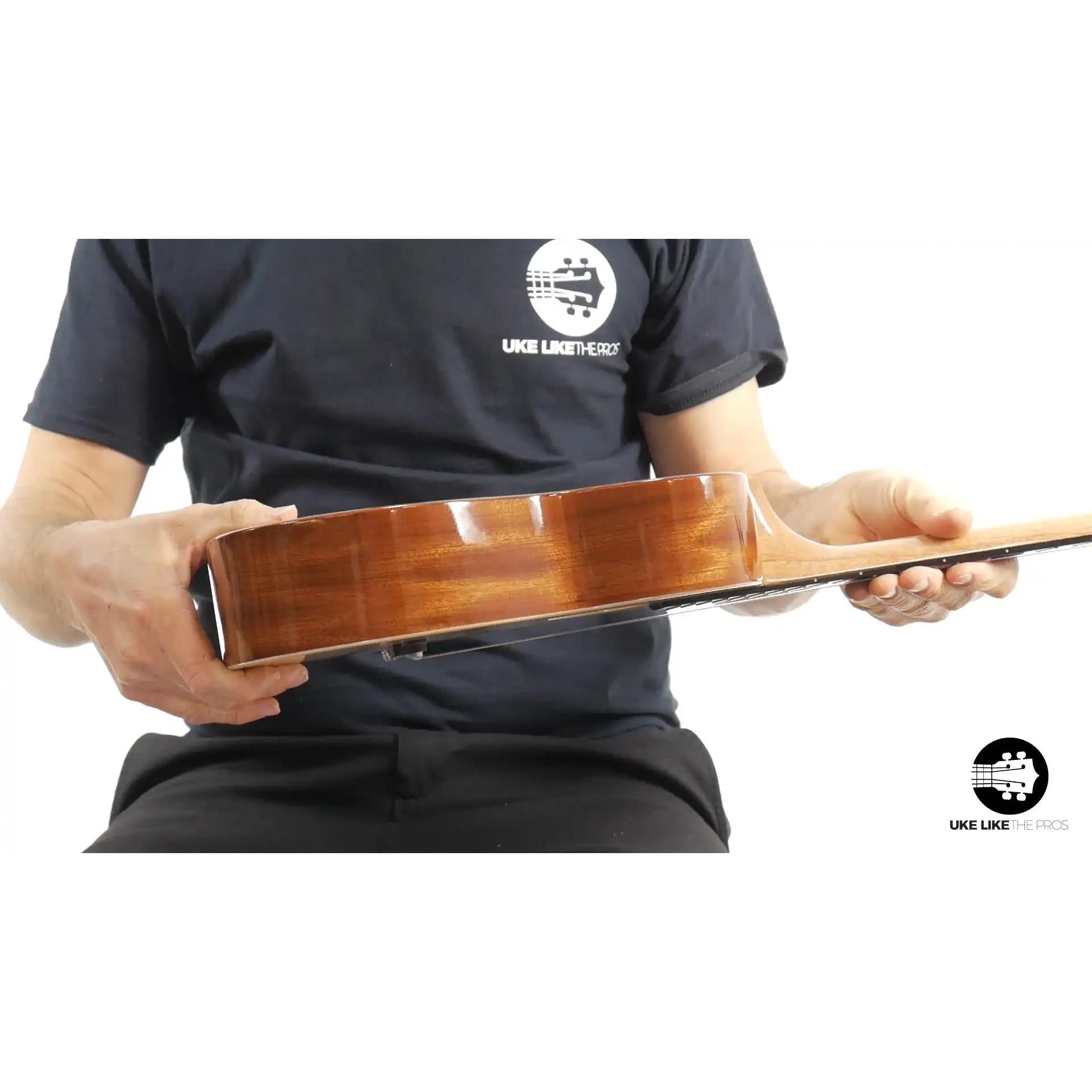 Side view of Rebel tenor ukulele with double wood binding at Terry Carter Music Store