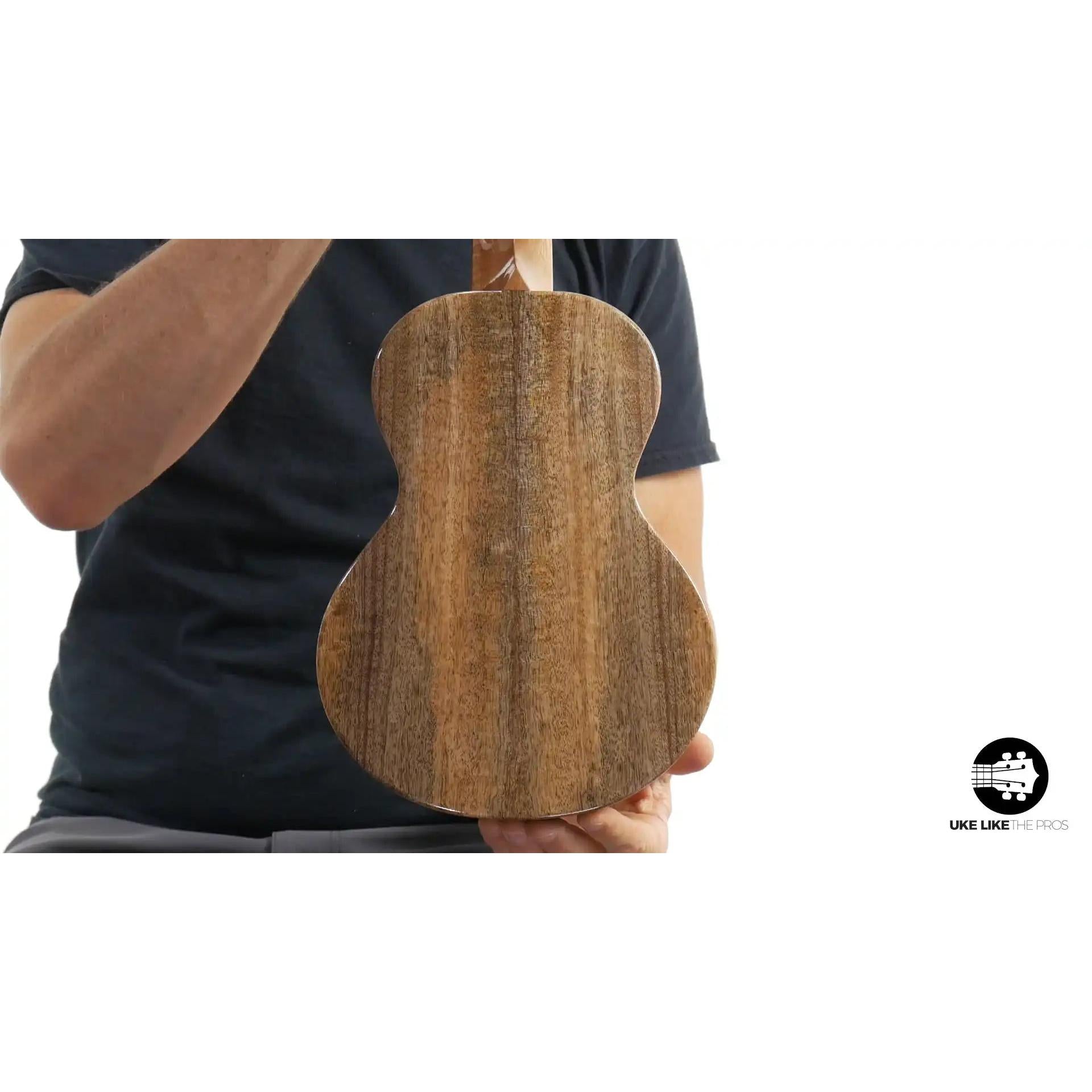Back of natural wood ukulele, double crème finish, displayed at Terry Carter Music Store
