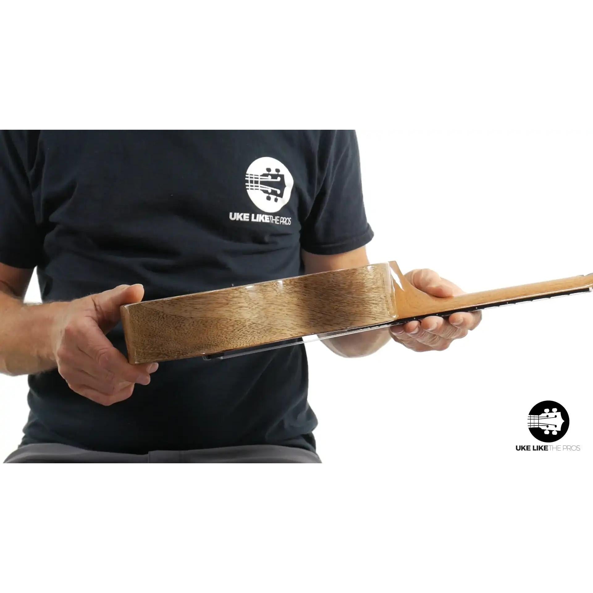 Rebel Double Creme ukulele side view with natural wood grain, Terry Carter Music Store