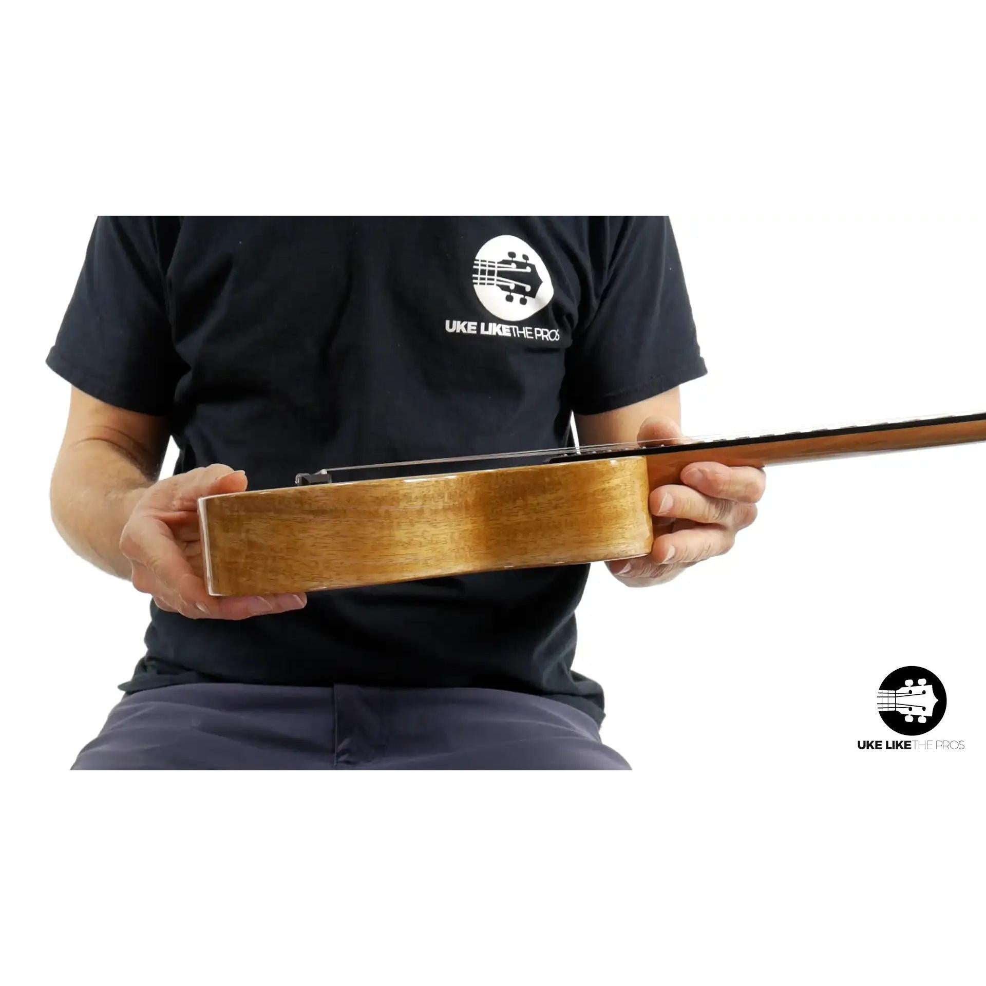 Side view of Rebel Double Creme Concert ukulele with natural wood finish at Terry Carter Music Store