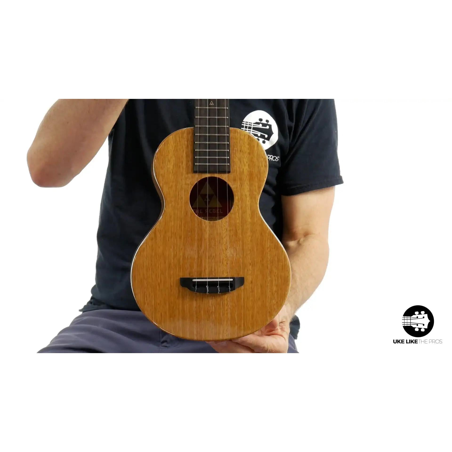 The Rebel ukulele natural wood finish, concert size, showcased at Terry Carter Music Store.