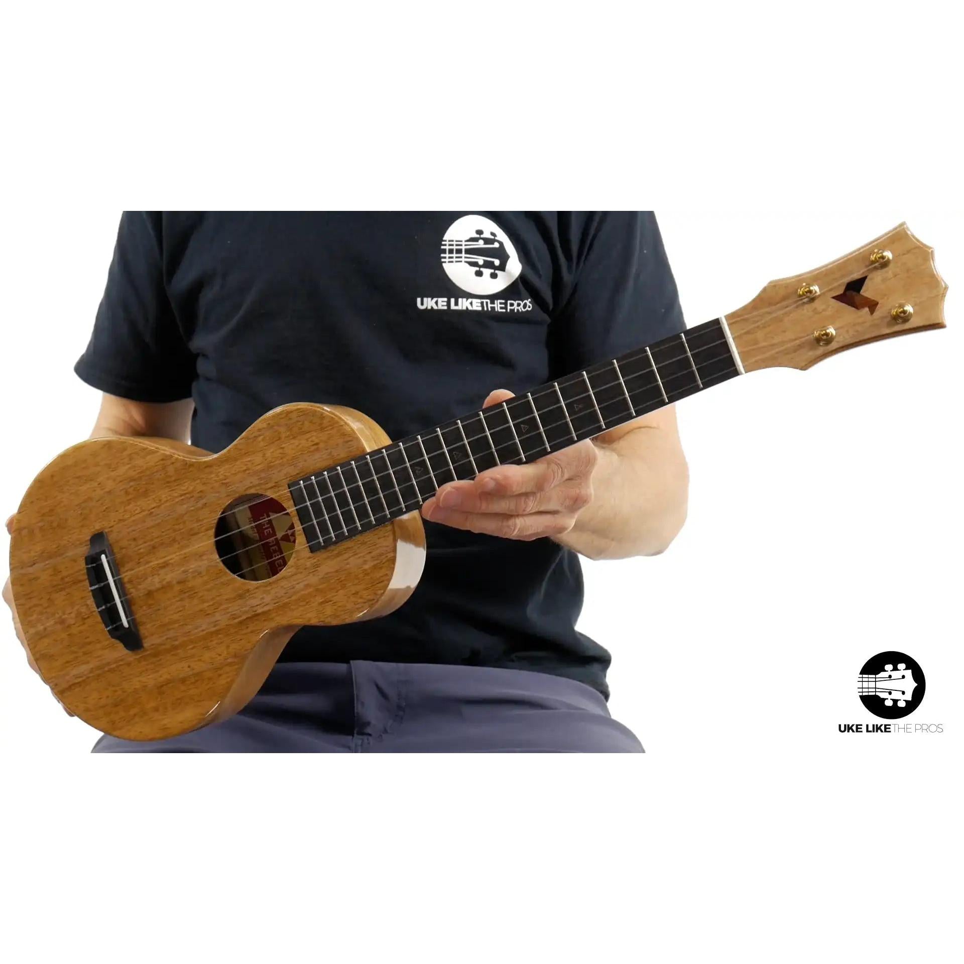 Rebel Double Creme Concert ukulele, natural wood finish, featured at Terry Carter Music Store