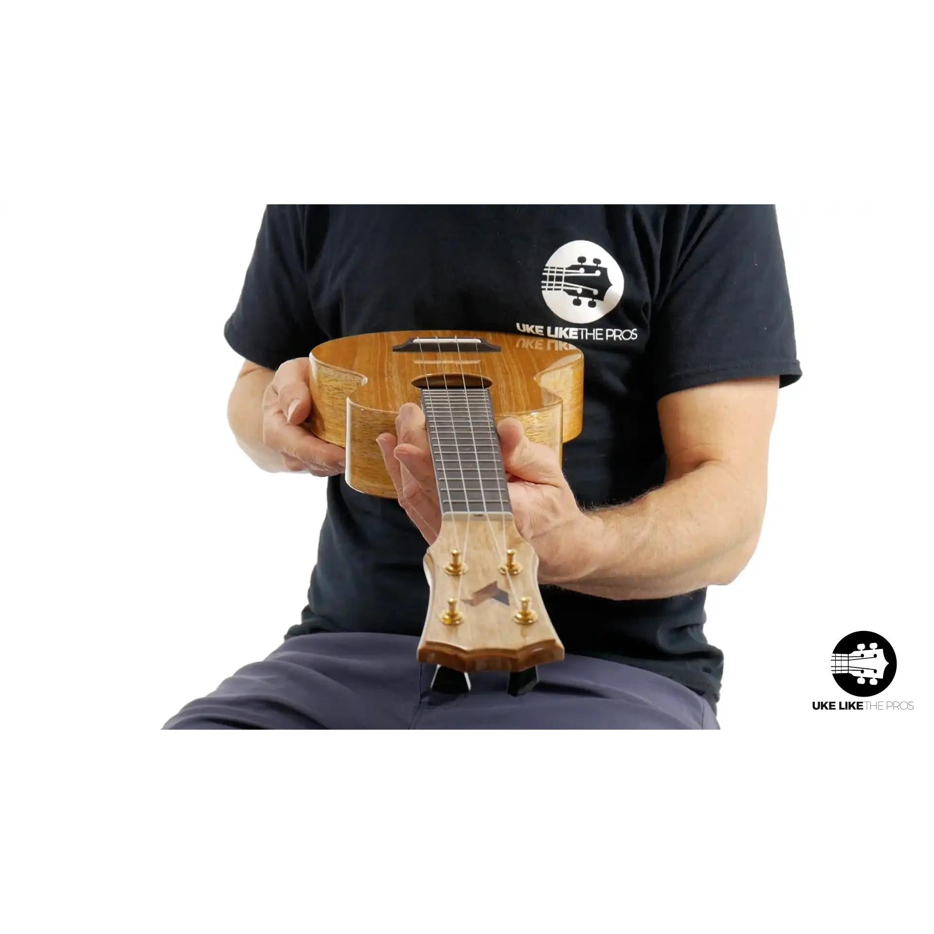 Rebel Double Creme Concert ukulele with natural wood finish, displayed at Terry Carter Music Store