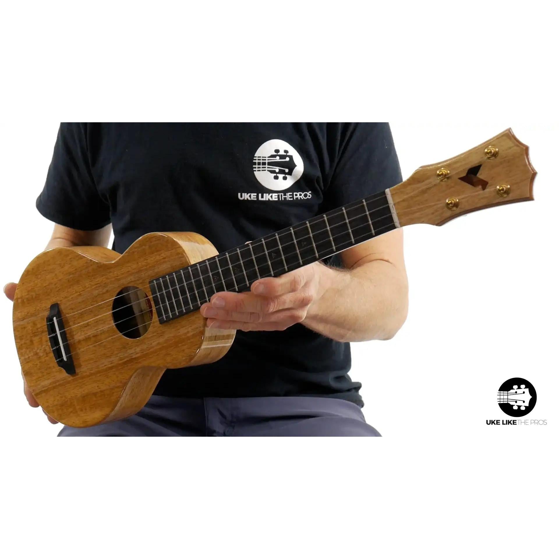 Rebel Double Creme ukulele with natural wood finish, close-up of headstock and body at Terry Carter Music Store