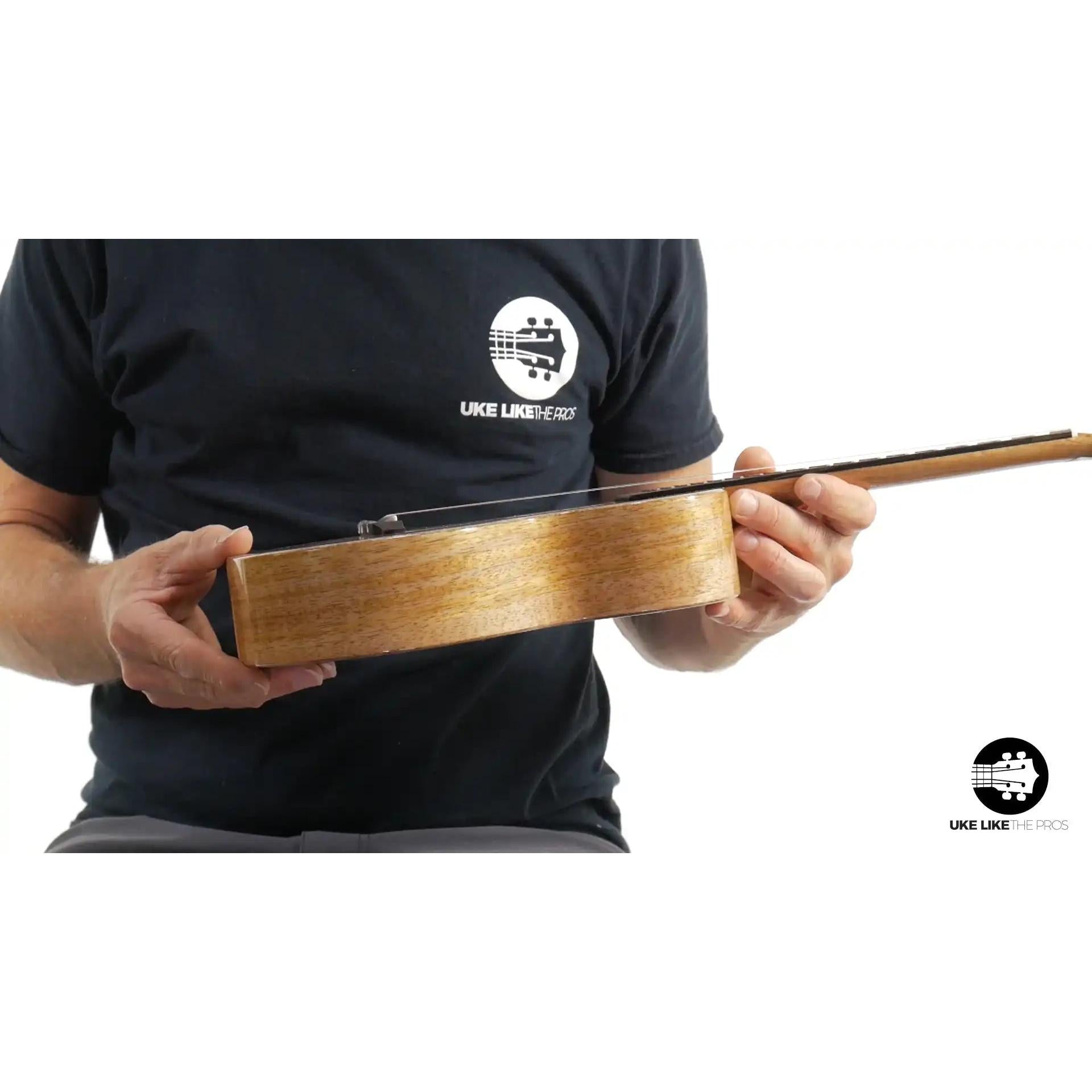 Rebel Double Creme ukulele side view, natural wood, at Terry Carter Music Store