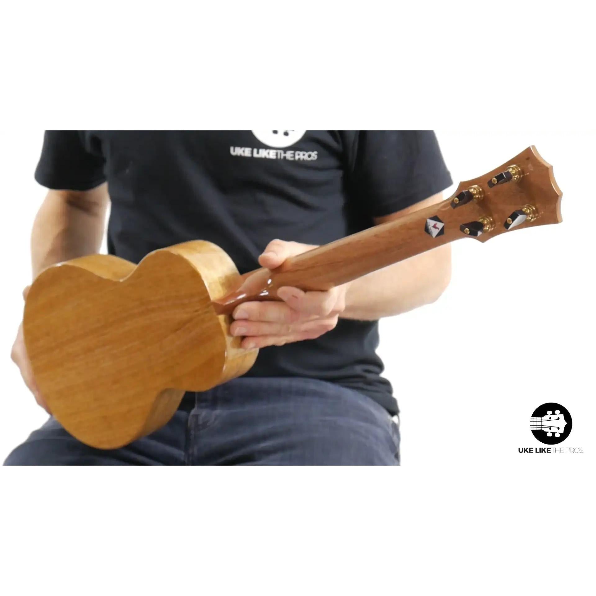 Rebel ukulele headstock and back, natural wood finish, at Terry Carter Music Store.