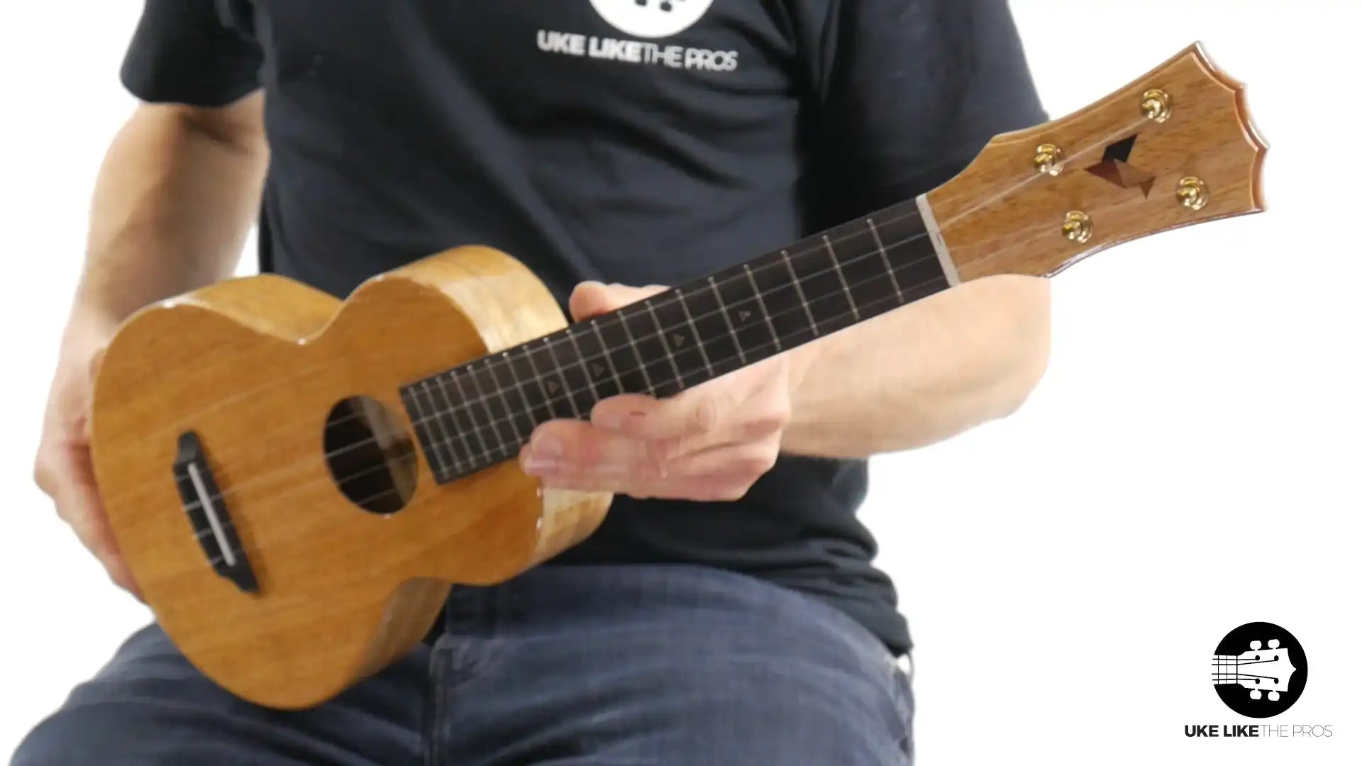 Rebel Double Creme ukulele with natural wood finish, headstock front view at Terry Carter Music Store