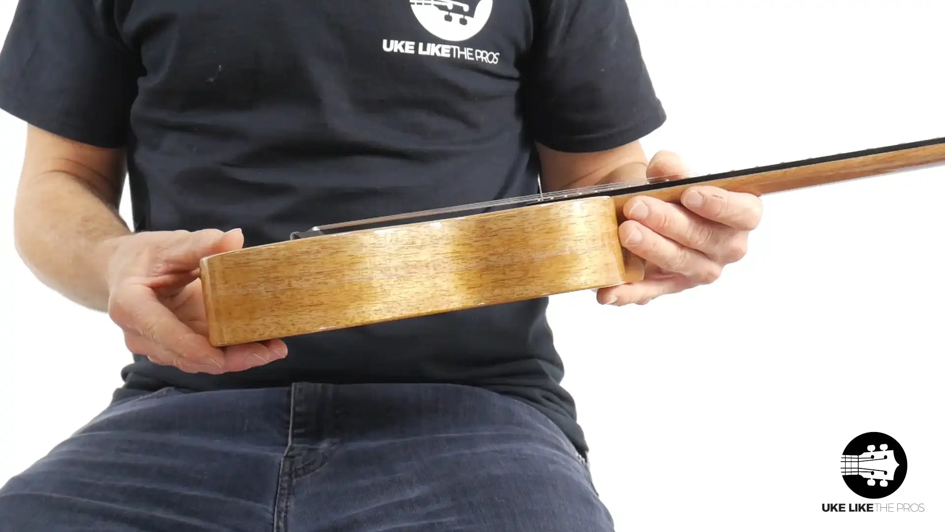 Side view of Rebel Double Creme ukulele with natural wood finish at Terry Carter Music Store.