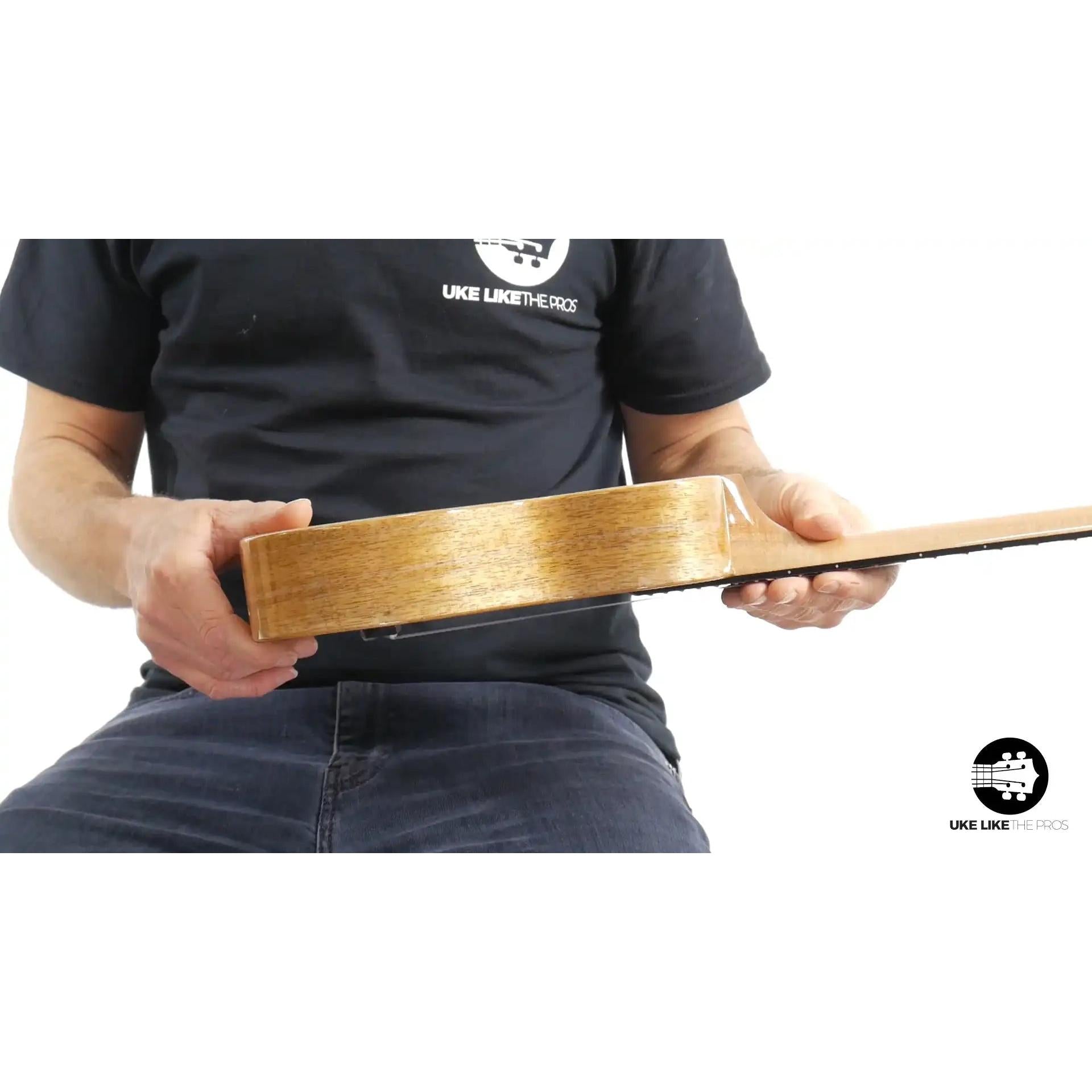 Side view of Rebel ukulele with natural wood body at Terry Carter Music Store