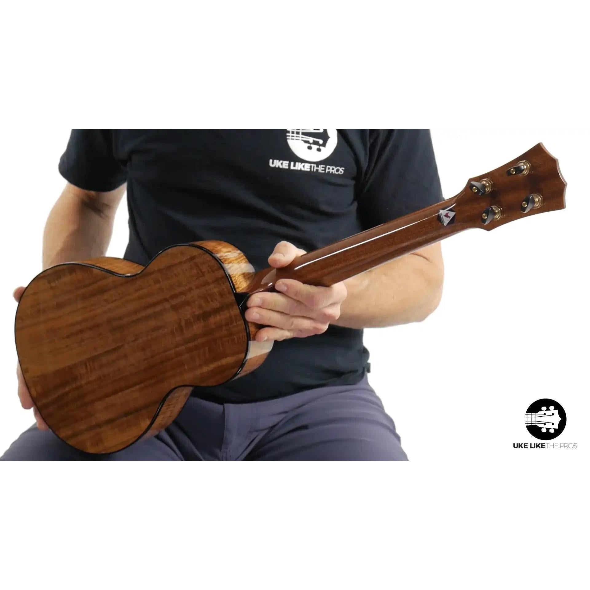 Rebel Pluto ukulele with natural wood grain finish at Terry Carter Music Store