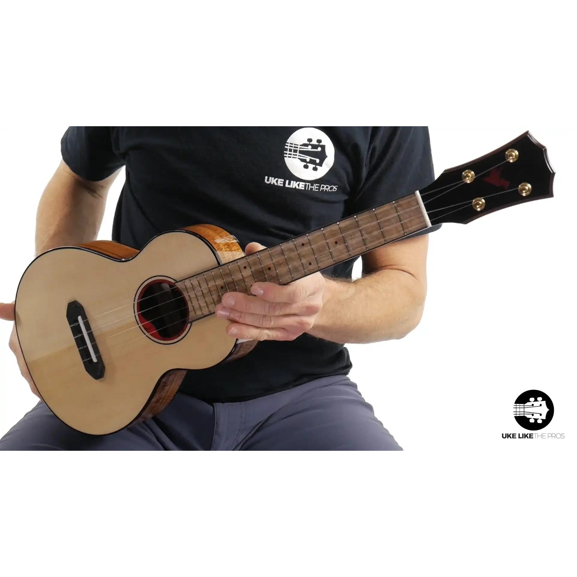Rebel Pluto Imperial Guard ukulele with natural wood top at Terry Carter Music Store