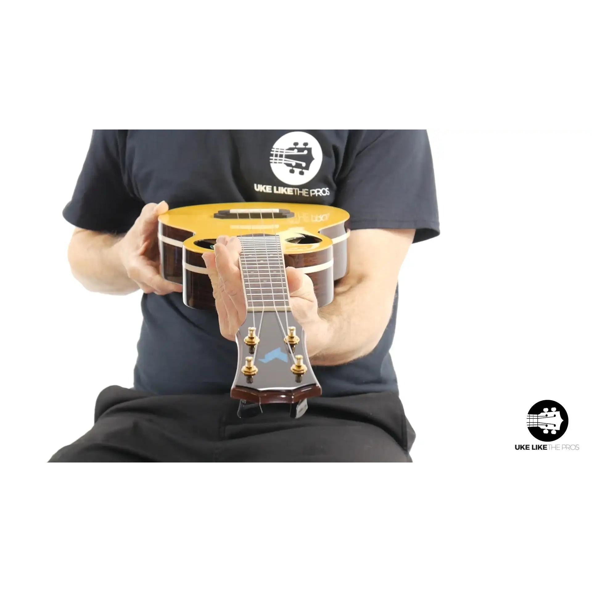 Rebel Quark ukulele with glossy wood finish front view, showcased at Terry Carter Music Store.
